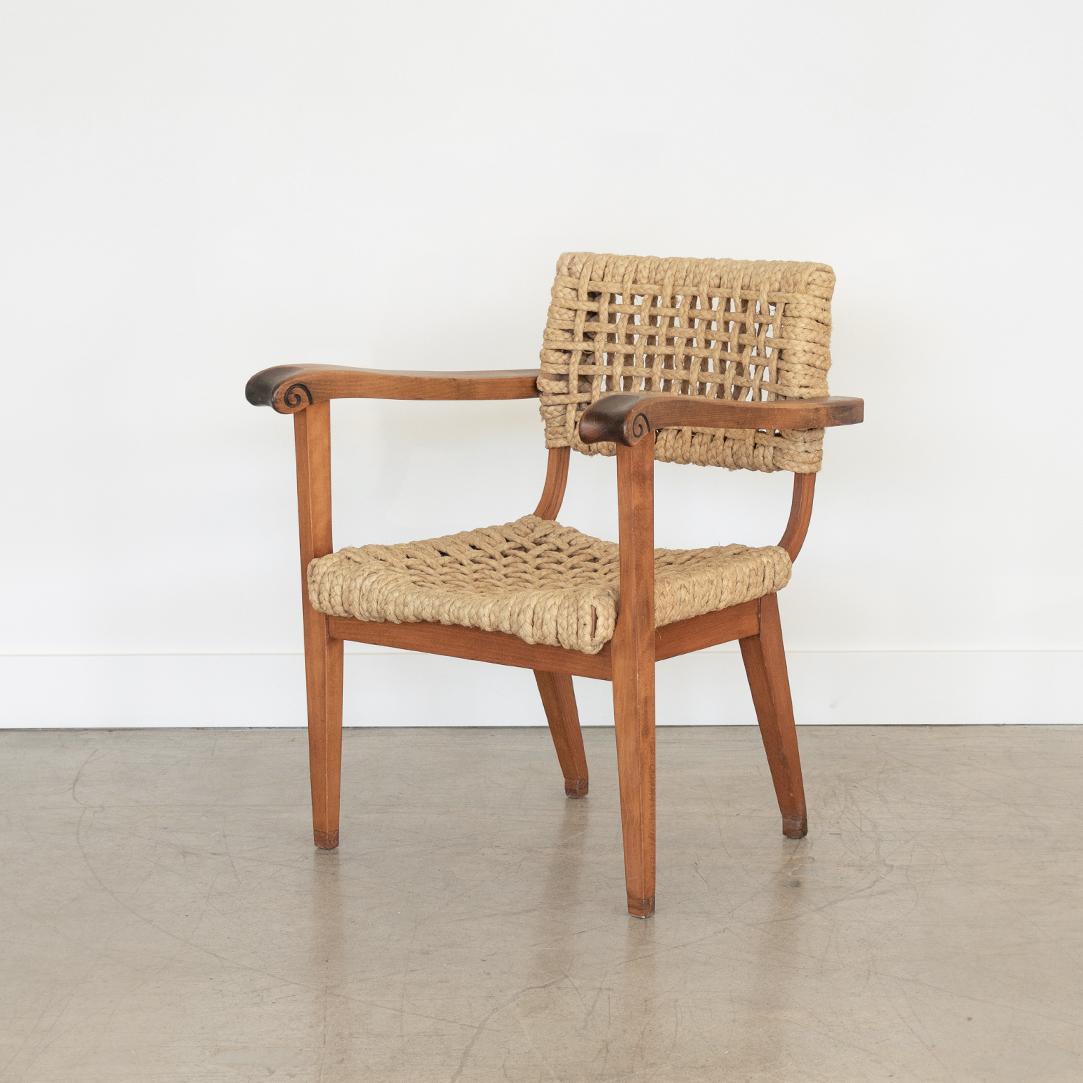 Vintage Adrien Audoux & Frida Minet lounge chair from France, 1950s. All original wood and rope seat with nice patina and age. Beautiful carved detailing on arms.