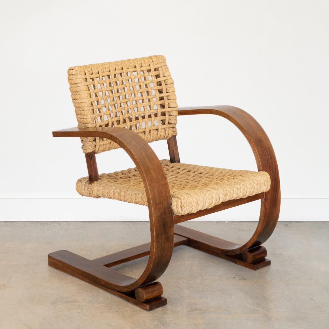 Vintage Adrien Audoux & Frida Minet lounge chair from France, 1950s. Beautiful curved bentwood arms with dark stain on wood. All original rope seat in great condition with nice patina and age. Manufactured by Vibo Vesou. 