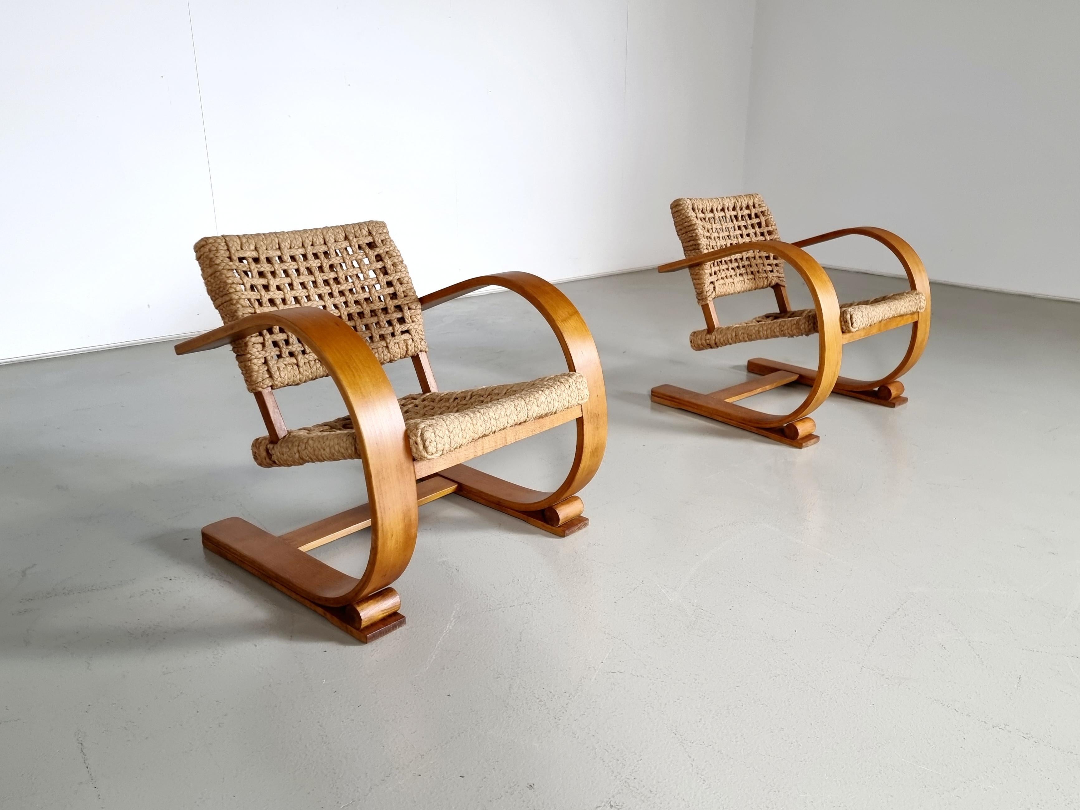 Adrien Audoux and Frida Minet for Vibo, France. A French couple of modernist designers that has been very productive during the 1940s and 1950s. 
These chairs are made in the 1940s. The frame of bentwood, braided rope seats, and backrests. Stamp
