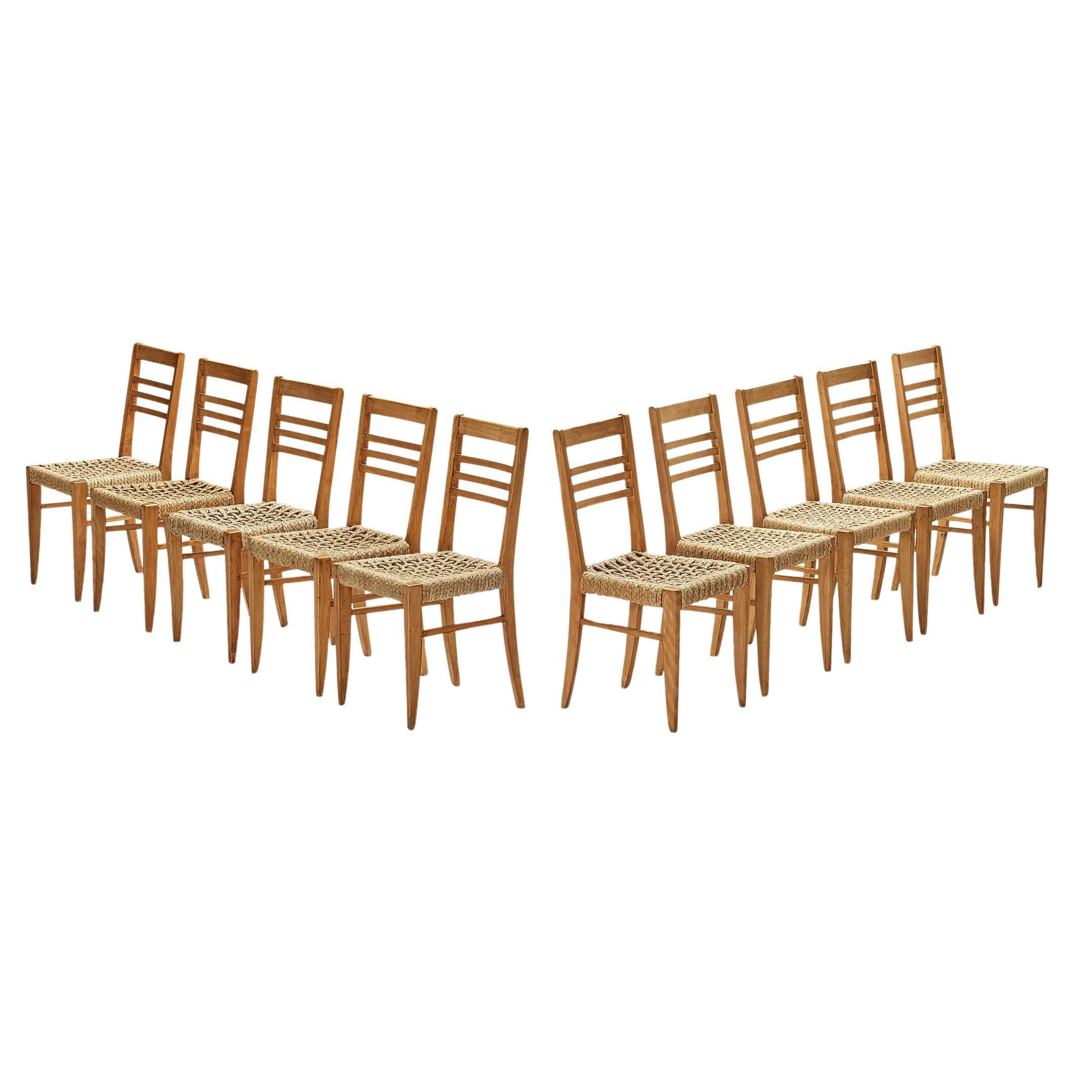 Adrien Audoux & Frida Minet: Zehn Esszimmerstühle mit geflochtenem Saum 
