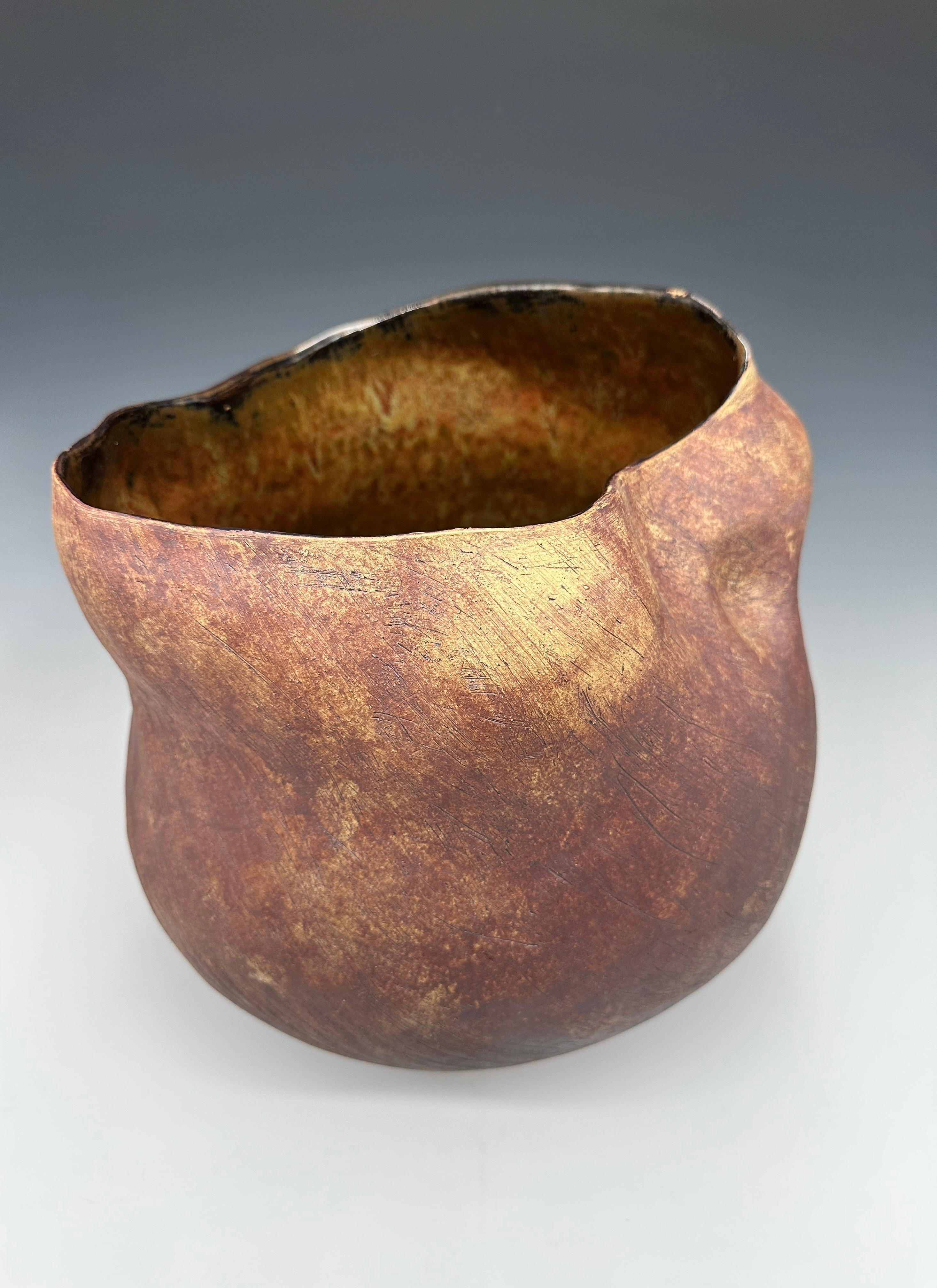 Tall Rust Stoneware Ceramic Sculpture Vessel
Dimensions: 15 H × 11 W × 11 D
Medium: Hand-formed, coiled stoneware ceramic pot, glazed interior, oxide wash.

Adrienne Fierman’s work embodies the meditative balance between form, material, and spirit