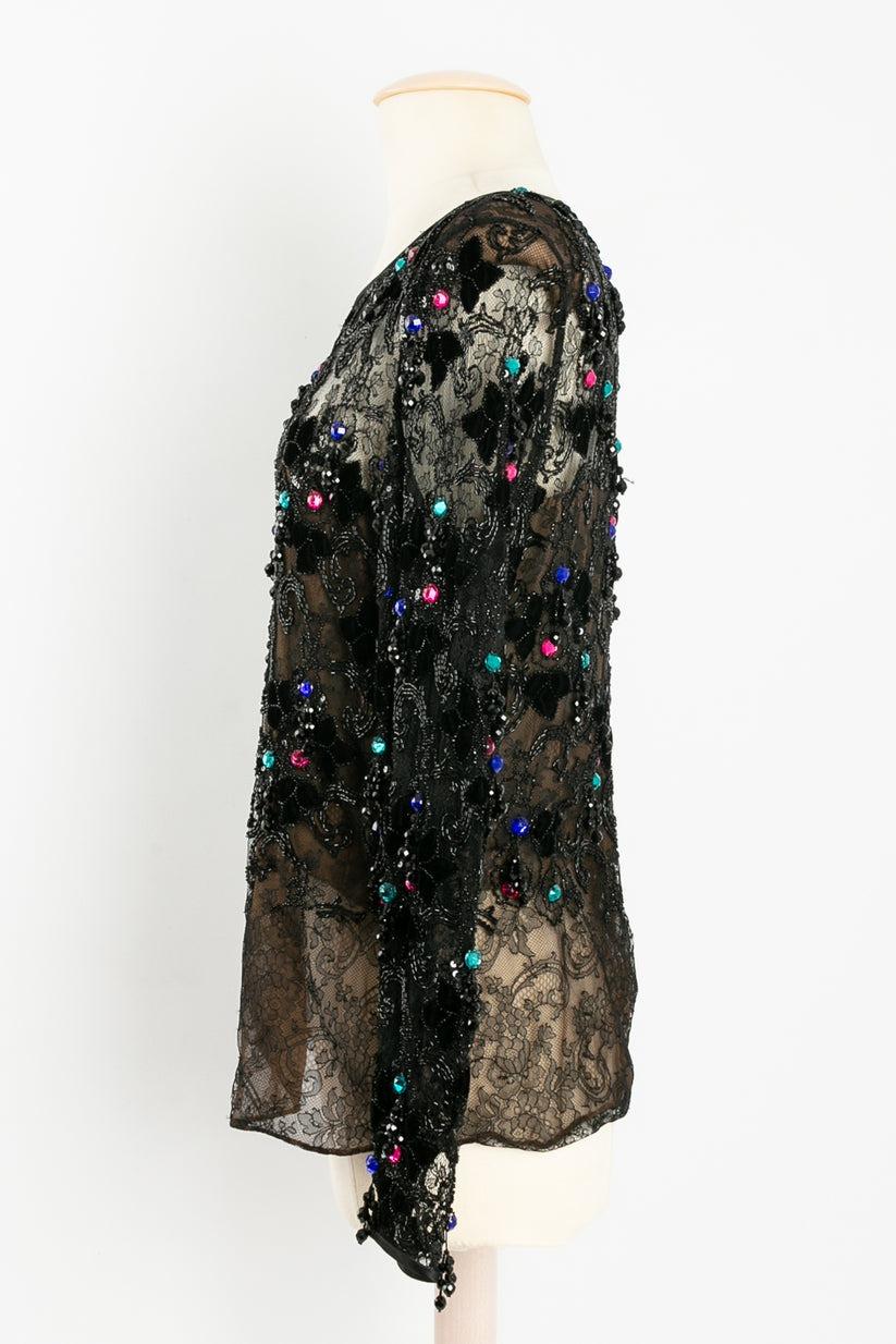ADRIENNE HAUTE COUTURE - Long sleeve top in lace and silk embellished with black velvet, beads, and multi-color rhinestones. No composition or size tag, it fits a size 38/40 FR.

Additional information:
Condition: Very good condition
Dimensions: