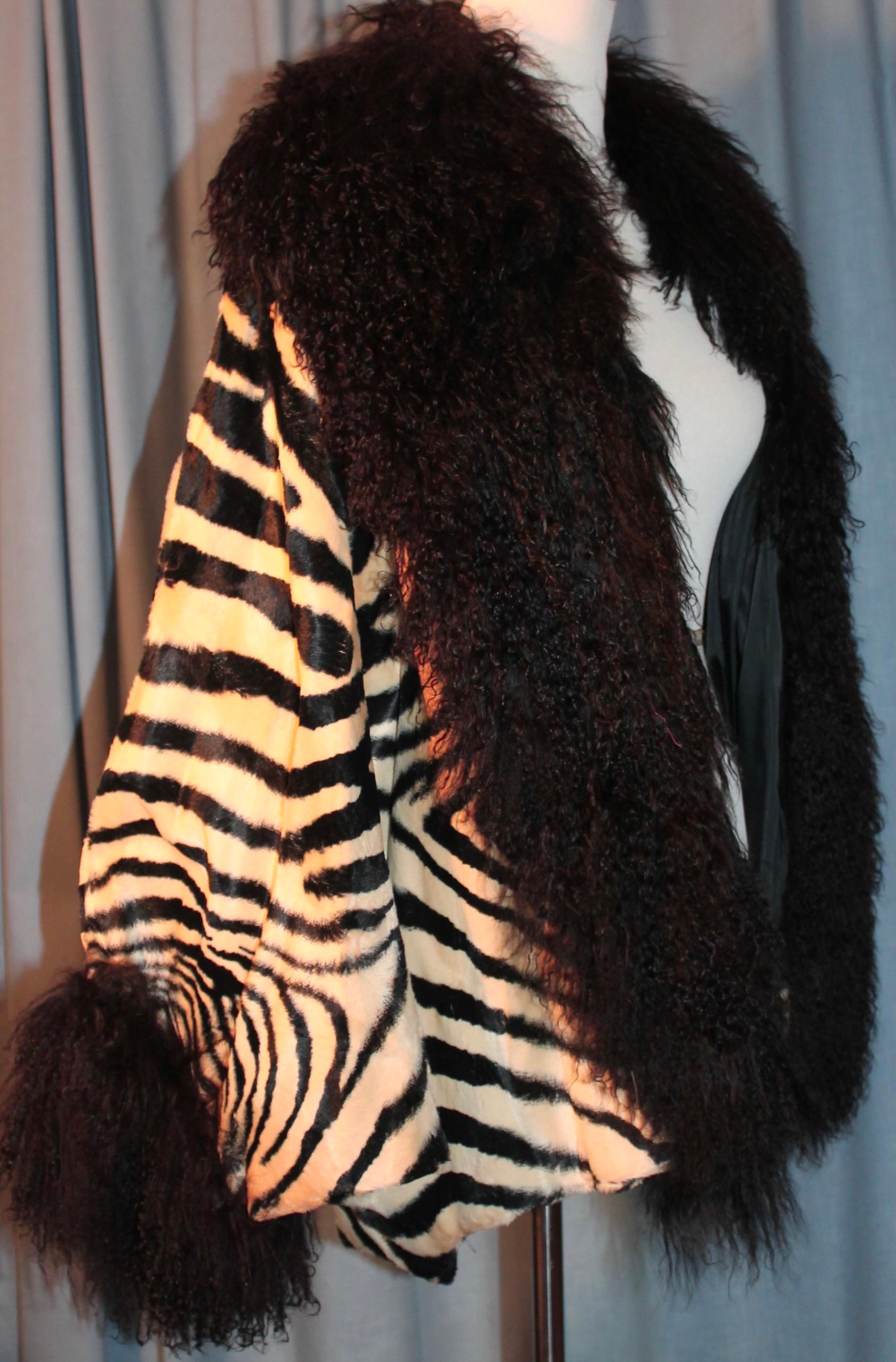 Offering a spectacular Adrienne Landau for Elizabeth Arden Salon, Faux Zebra trimmed with black curly Mongolian Lamp, collar and cuffs. Jacket.  Appear unworn, with original price tag attached.