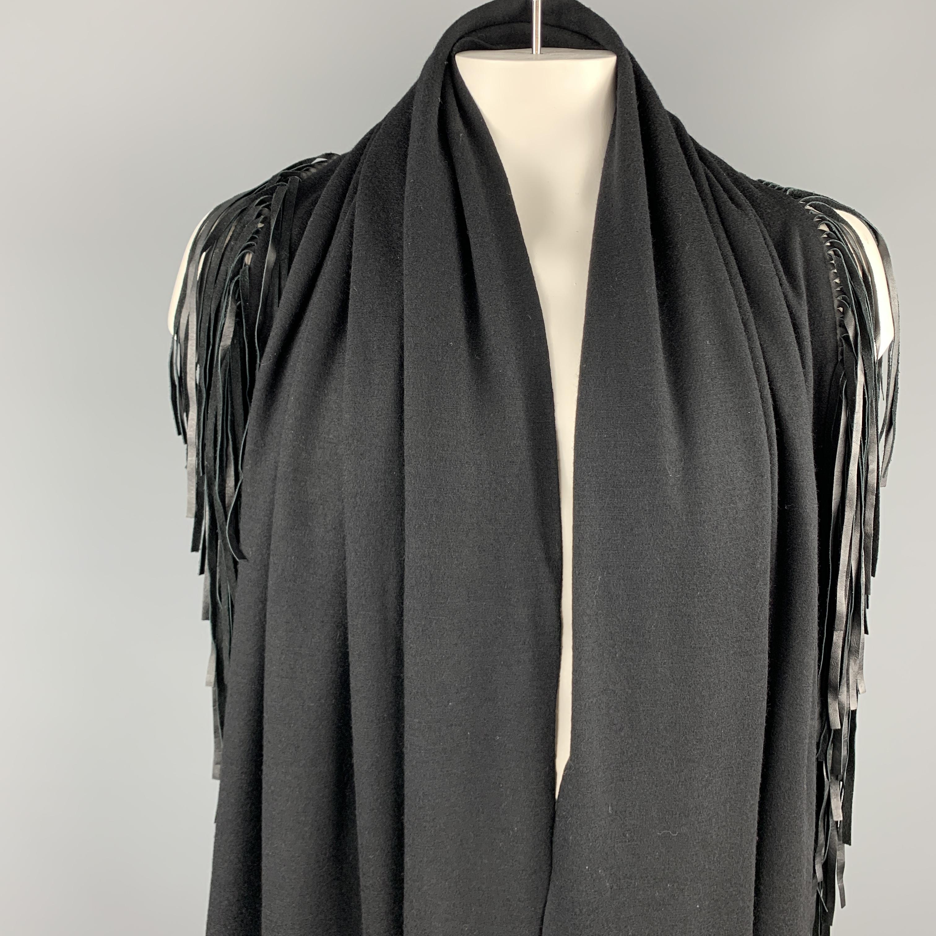 ADRIENNE LANDAU shawl comes in a black wool with a ten inch fringe trim. 

Excellent Pre-Owned Condition. 

Measurements: 

23 in. x 76 in. 