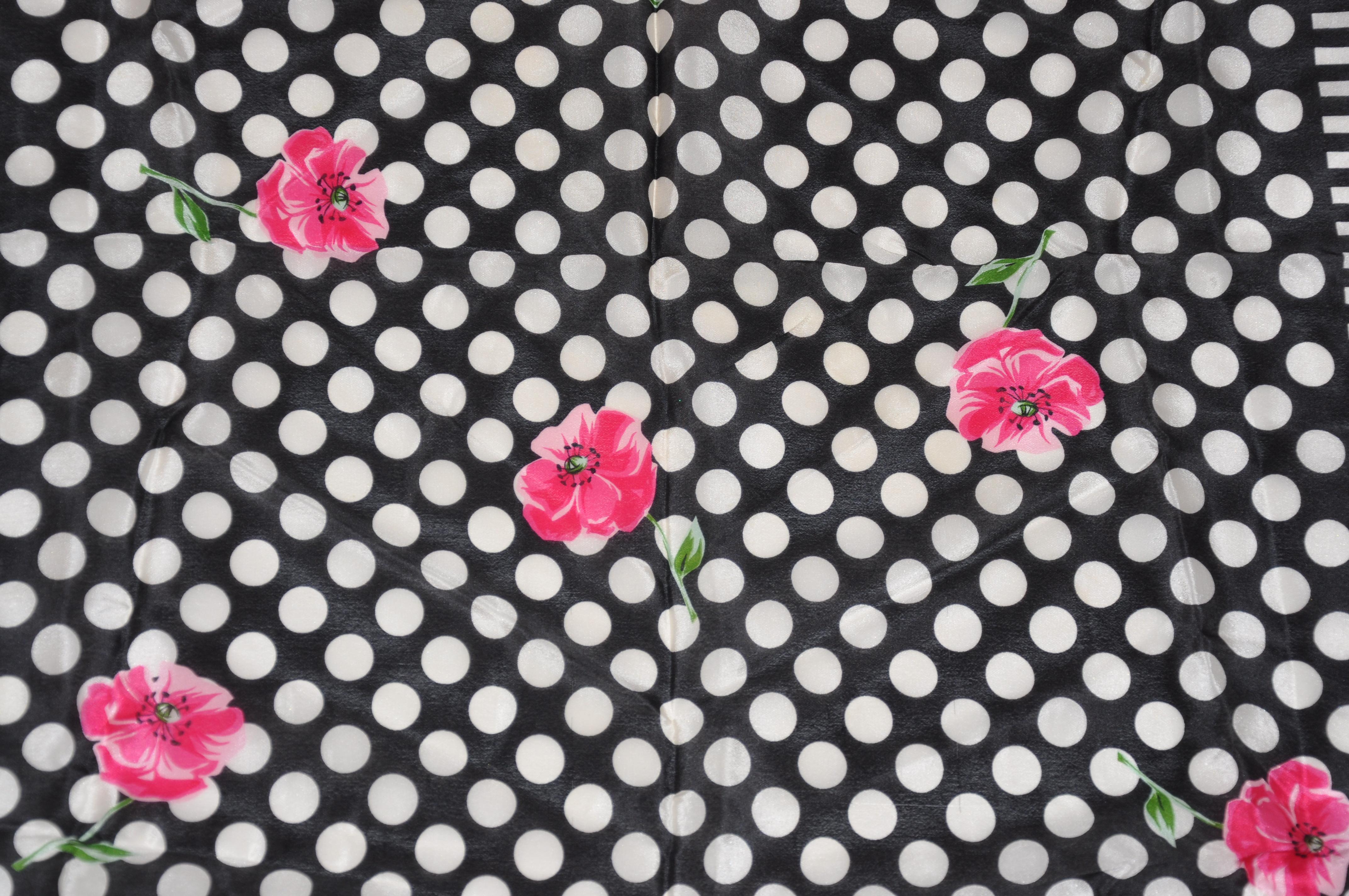        Adrienne Vittadini Wonderfully Joyous Popping Fuchsia Florals among Bold black and white stripes and polka dots silk scarf accented with rolled edges, measures 30 inches by 31 inches. Made in Italy.