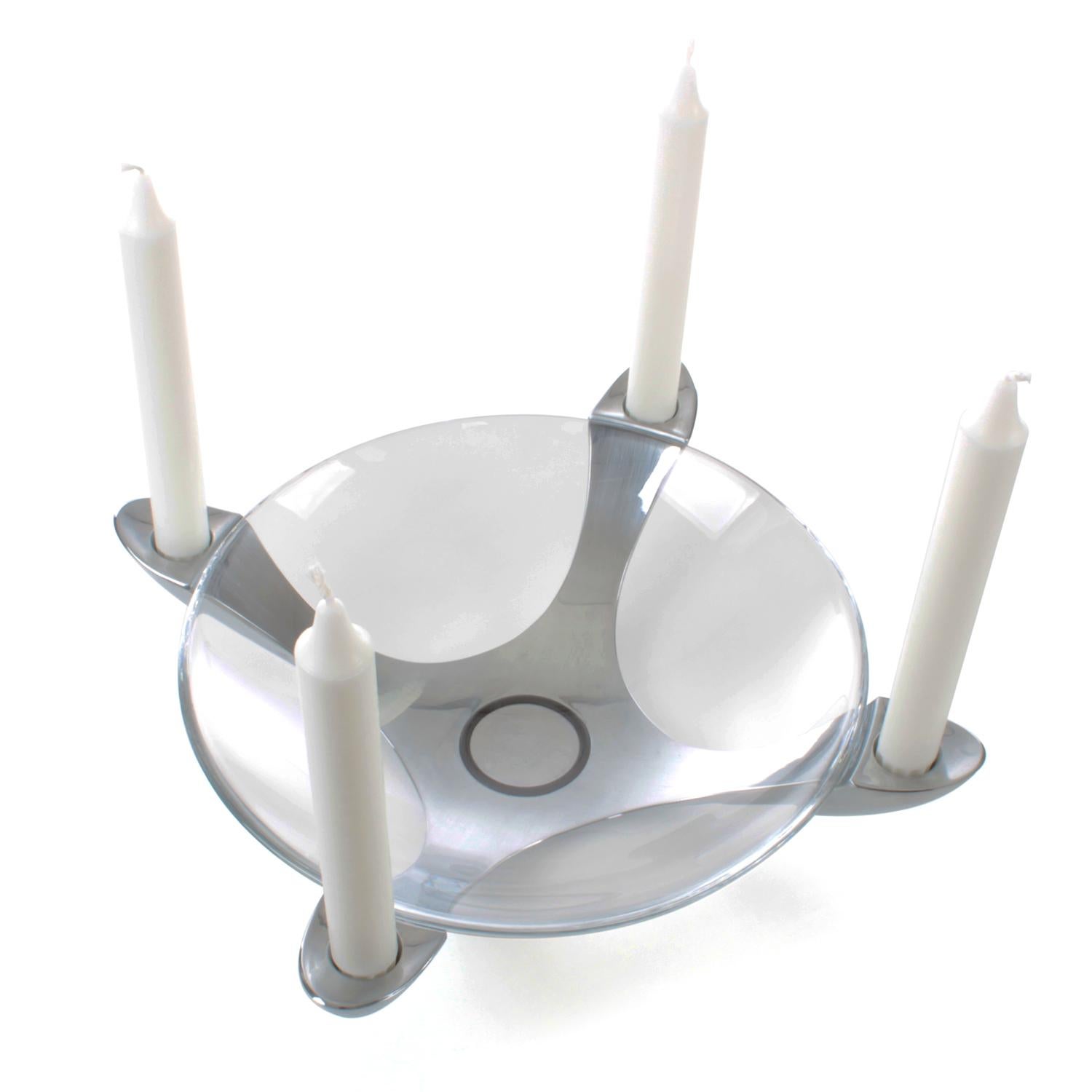 4-lights advent candleholder by Stelton - modern and very stylish stainless steel candleholder for four candles with glass bowl in the middle.

A stainless steel candleholder with a heavy center, from where four arms emerge, slightly curved