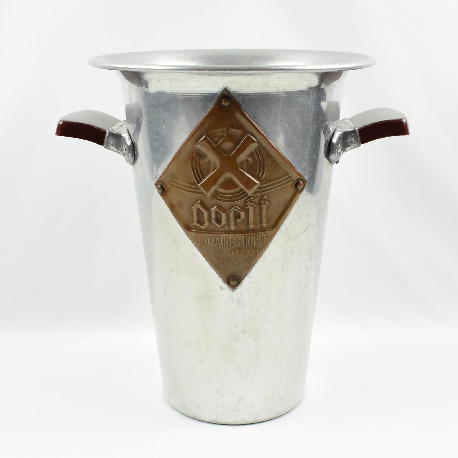 This is a stunning French modernist aluminum ice bucket or wine cooler crafted in the 1950s. Specially designed for tall Alsace white wine bottles, this bottle chiller will work with any other wine bottle. It was in use in restaurants in France in