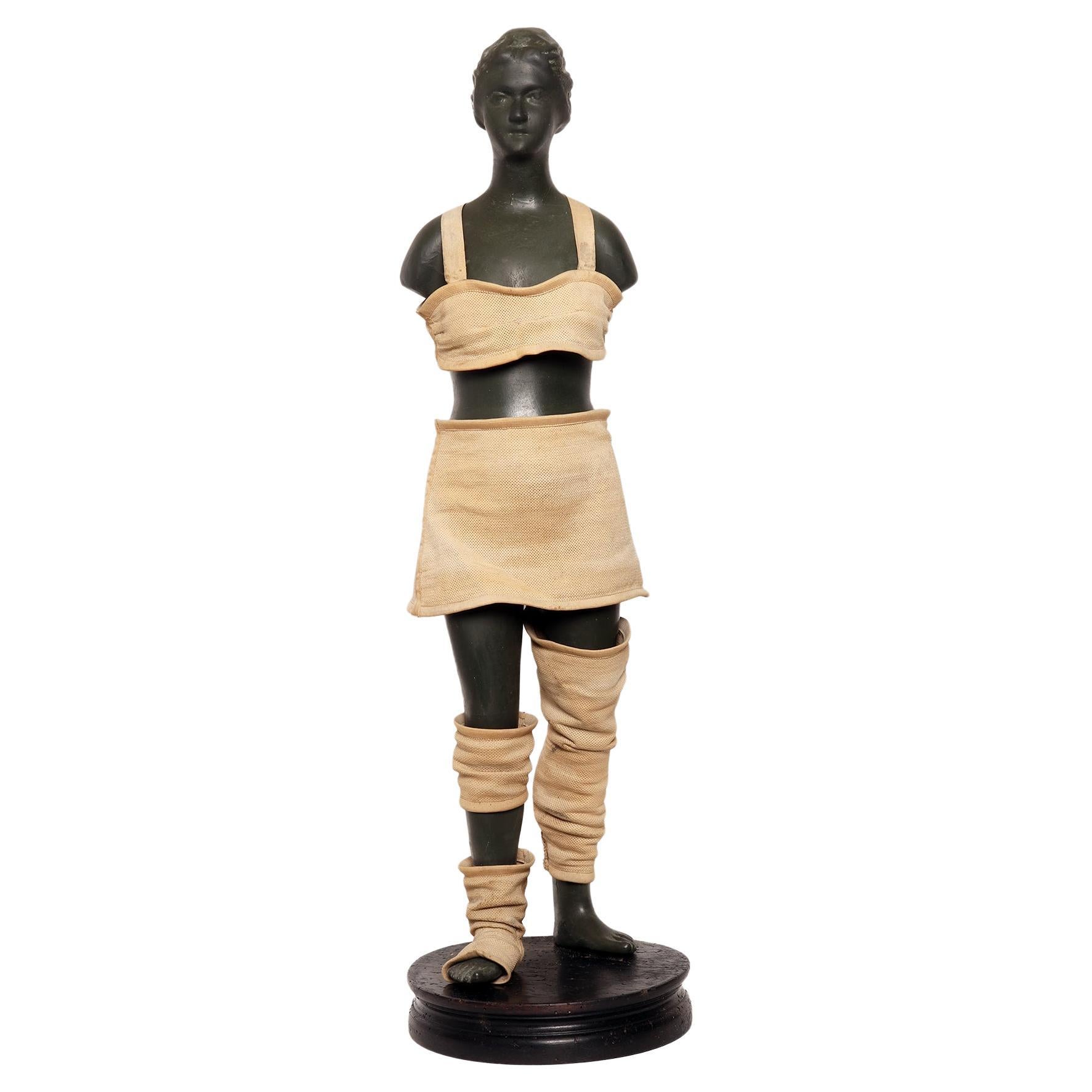 Advertising mannequin for elastic and containment belts, France 1920.
