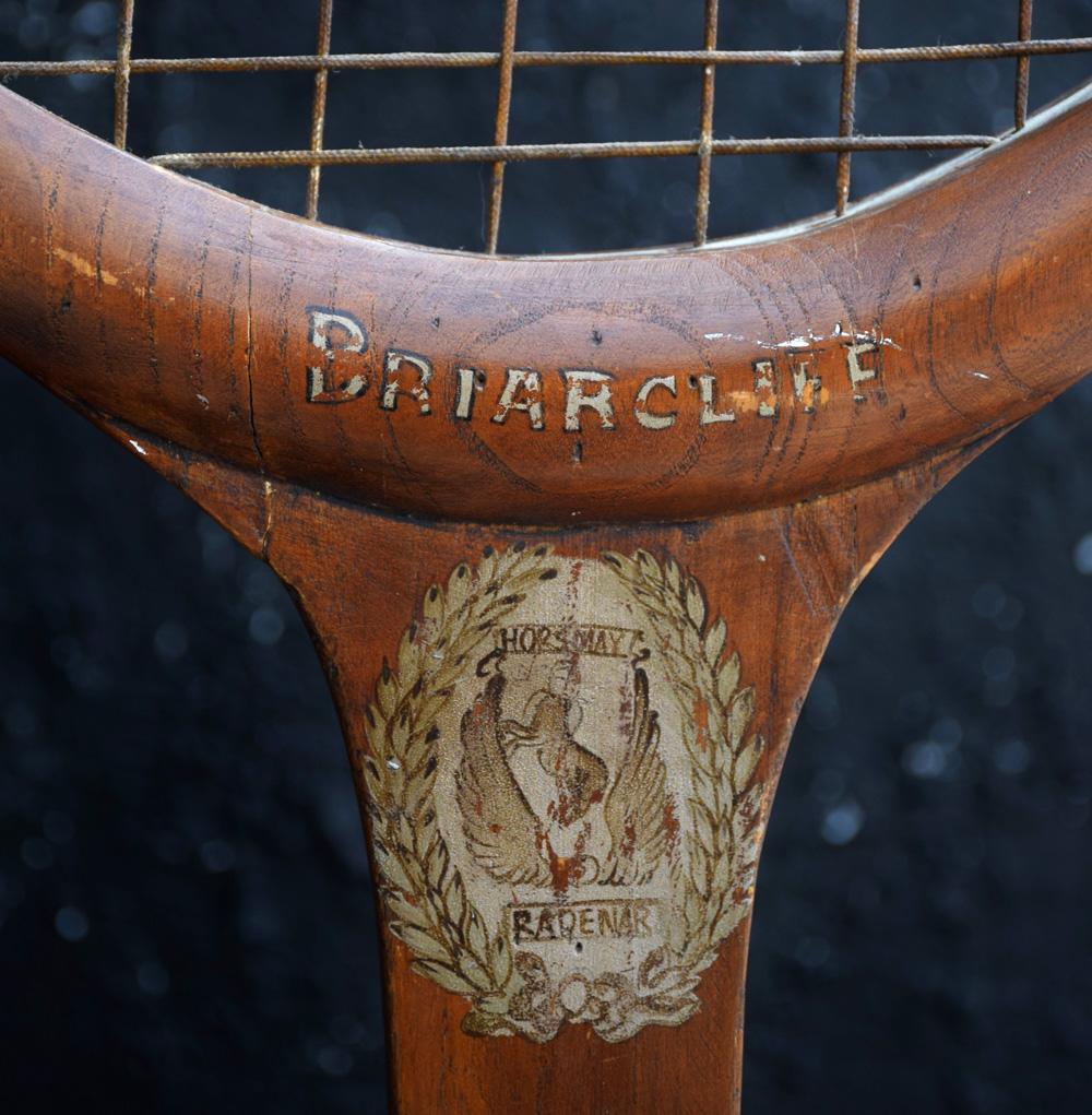 Item: Vintage handmade shop advertising oversized Tennis tacquet

This item would have originally stood in an English sports equipment shop window display, to promote the sale of tennis equipment. Made from scratch and sectioned pieces of carved