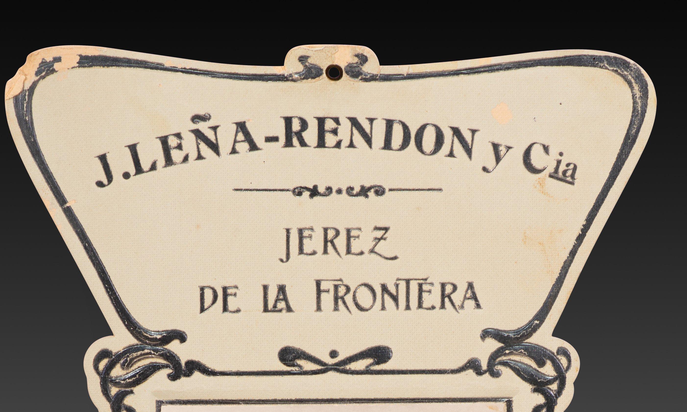 Werbeplakat, J. Leña Rendon und Co., Jerez de la Frontera, Feine Weine, Traubencognacs. Pappe. Berlin, erste Hälfte des 20. Jahrhunderts.
 Es hat Fehler. 
Interessanterweise erscheint das Foto der Dame auch auf einer Postkarte (BKWI Nr. 886-32, ca.