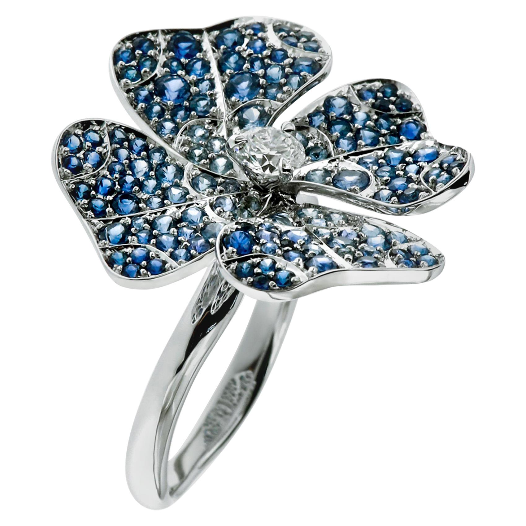AENEA 18 Karat White Gold Blue Sapphires E-F/VVS White Diamonds Flower Ring For Sale