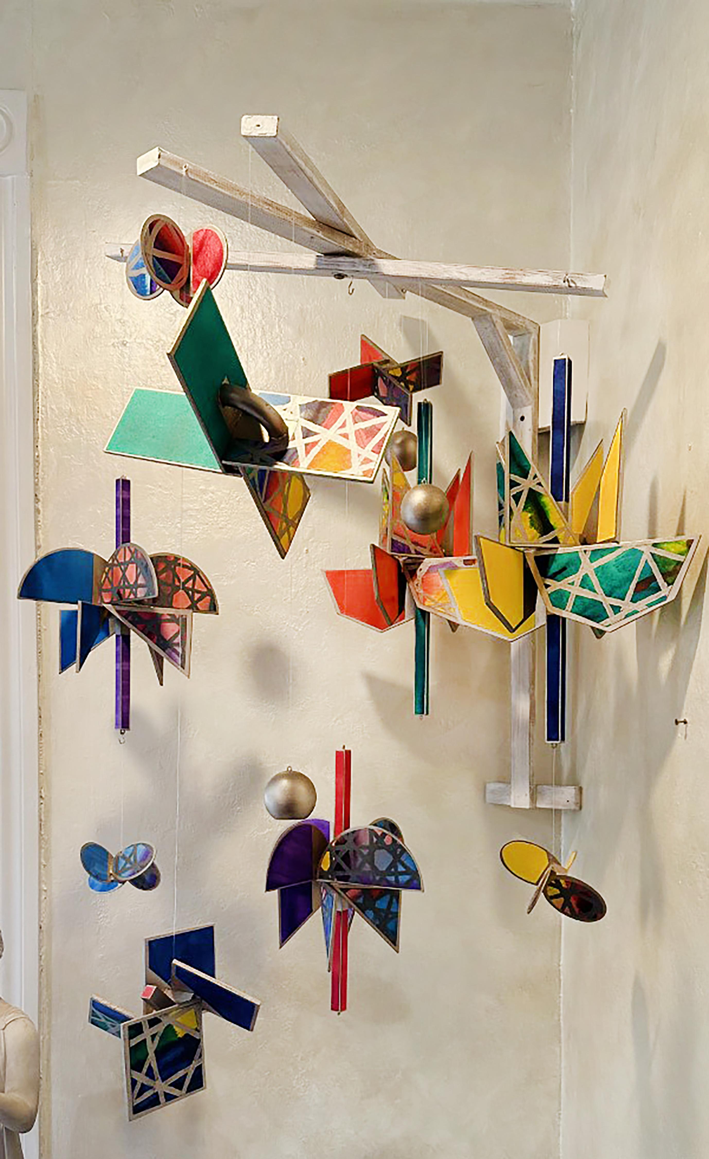 A vibrant, kinetic, and dynamic aerial turbine sculpture by artist Michael Tichansky. This colorful and fascinating piece was created by the artist in the mid 2010’s and was inspired partially by his involvement with the Madi Geometric art movement.