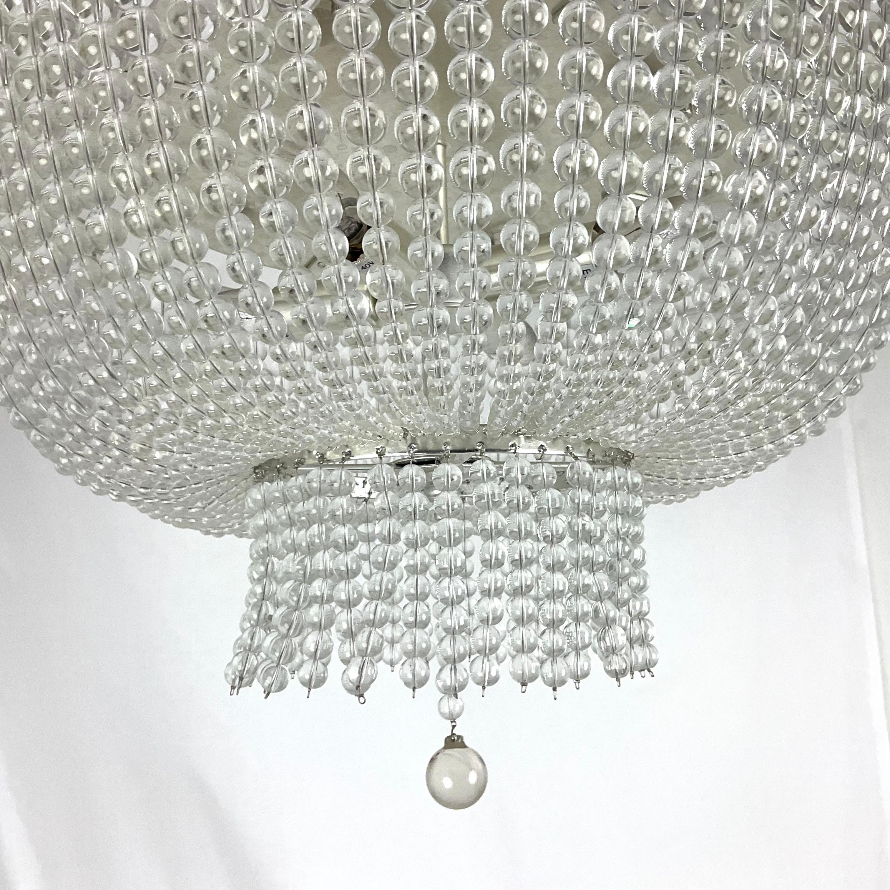 Bring timeless elegance into your home with this stunning crystal beaded flush mount chandelier. Featuring hundreds of perfectly aligned crystal beads, it creates a dazzling cascade of light that adds a touch of sophistication to any room. 

Design: