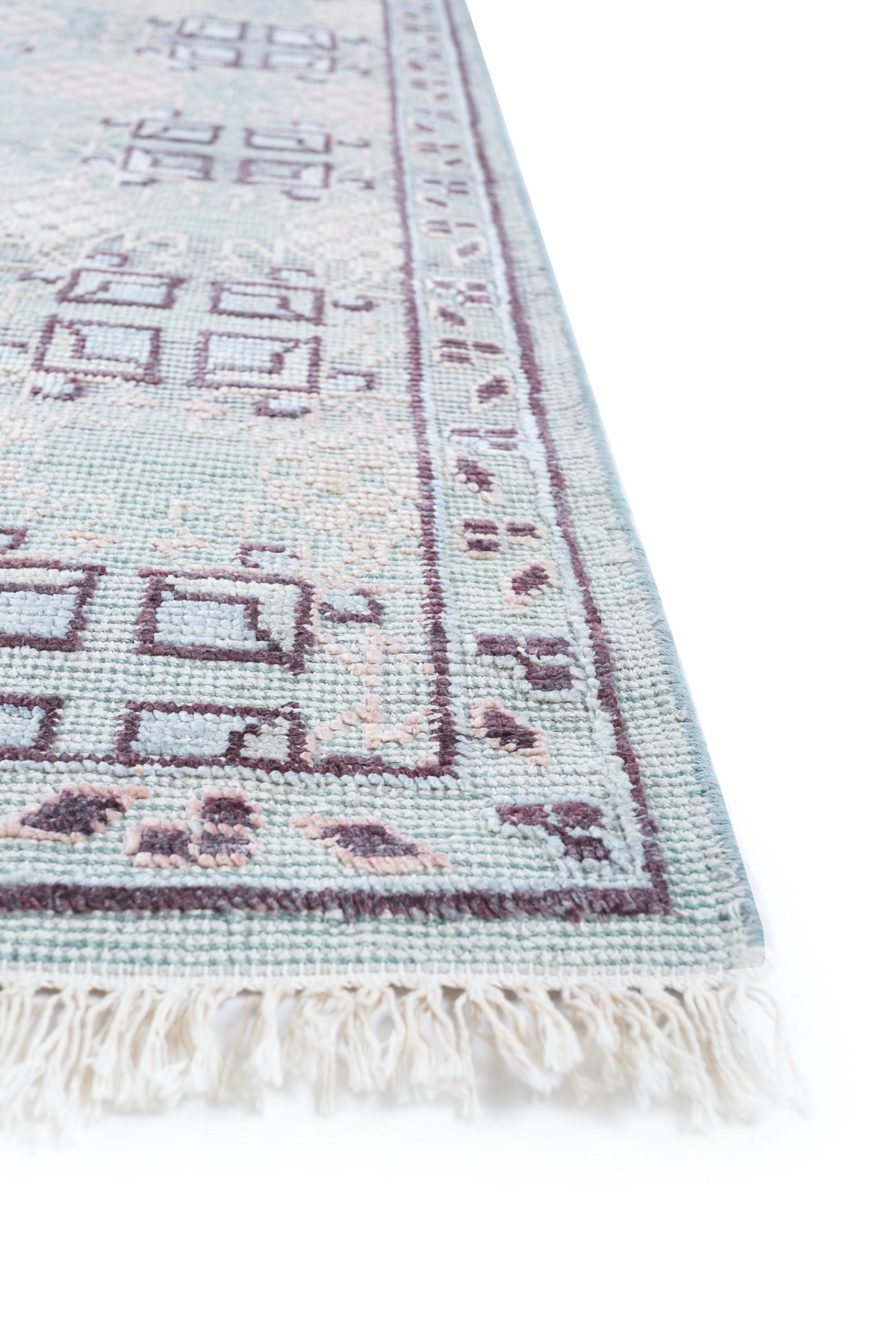 Ever wondered if a rug could transport you to an ethereal realm of aesthetics? Meet this masterpiece, hand-knotted to perfection in rural India. This traditional rug boasts ornate designs and patterns, intricately carved with the utmost precision.