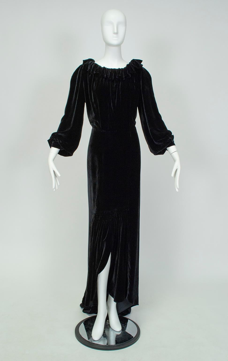 Eye catching for its liquid draping, open back and dramatic train, this gown is an unmistakable reminder of Hollywood’s Golden Age, when decency laws left designers scrambling for ways to outline the female form without simultaneously uncovering it.