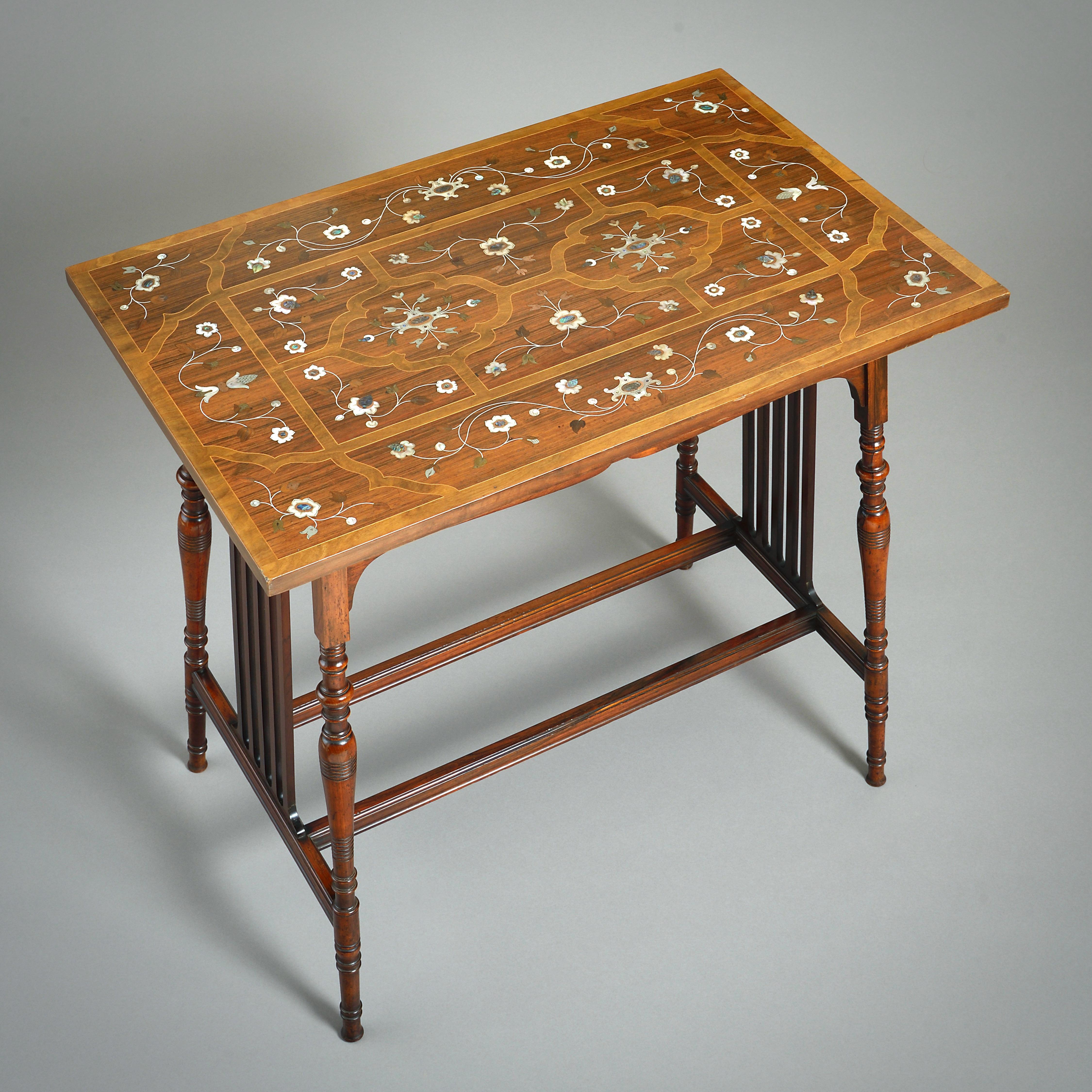 A FINE AESTHETIC MOVEMENT BLACK ROSEWOOD CENTRE TABLE INLAID WITH MOTHER-OF-PEARL, ABALONE, BRASS AND COPPER, Circa 1880.