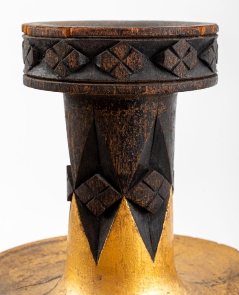 Aesthetic Movement carved and gilt wood ornamental vase in the shape of a handle-less elongated amphora, carved with geometric eight-pointed star design, upon a round base. In very good vintage condition.

Dealer: S138XX