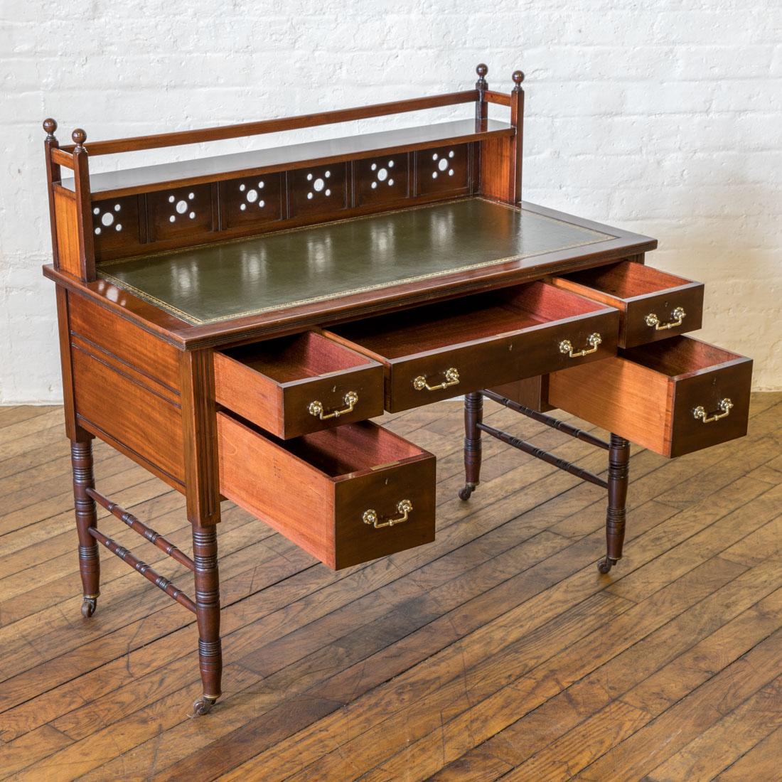 A super quality mahogany desk with strong Aesthetic design details. All the drawers are made from solid mahogany including the linings and are enhanced with beautiful cast brass handles. The legs are double stretchered to the sides to give extra