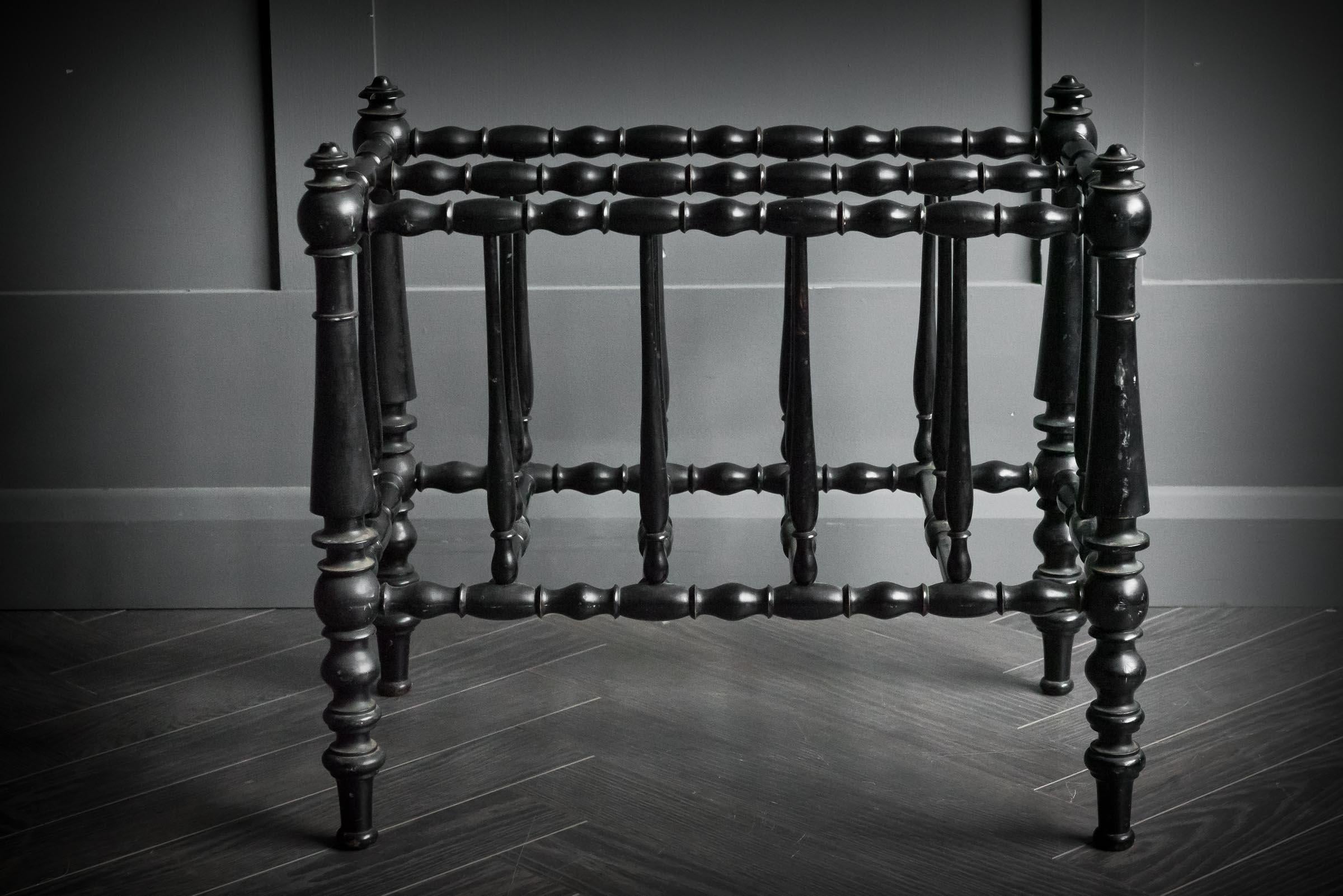 Stunning ebonised Canterbury finished in black lacquer prominent of the aesthetic movement.