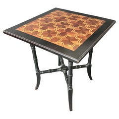 Aesthetic Movement ebonised table with parquetry top