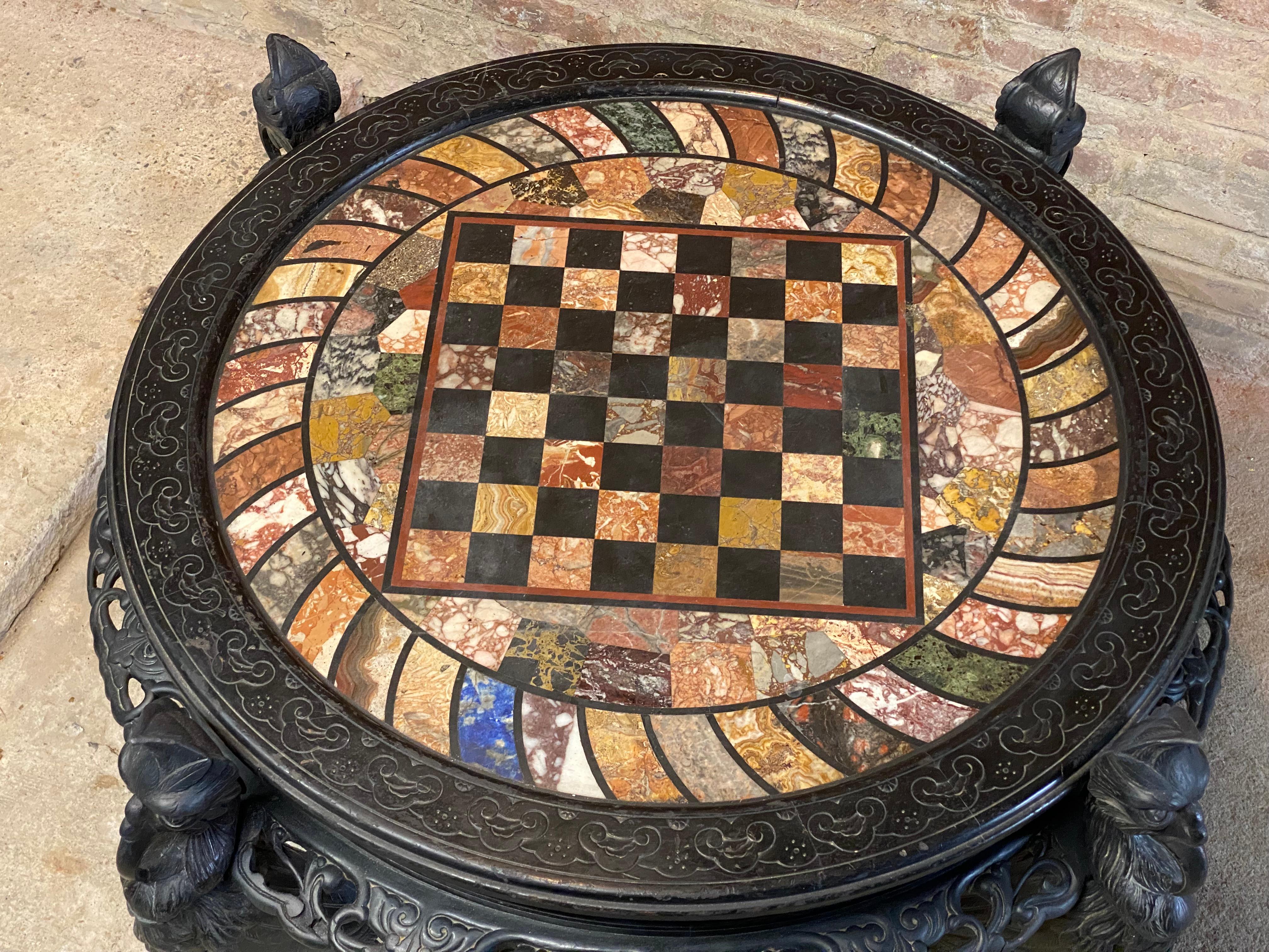 Aesthetic Movement Ebonized Griffin Specimen Top Chess Table In Good Condition For Sale In Garnerville, NY