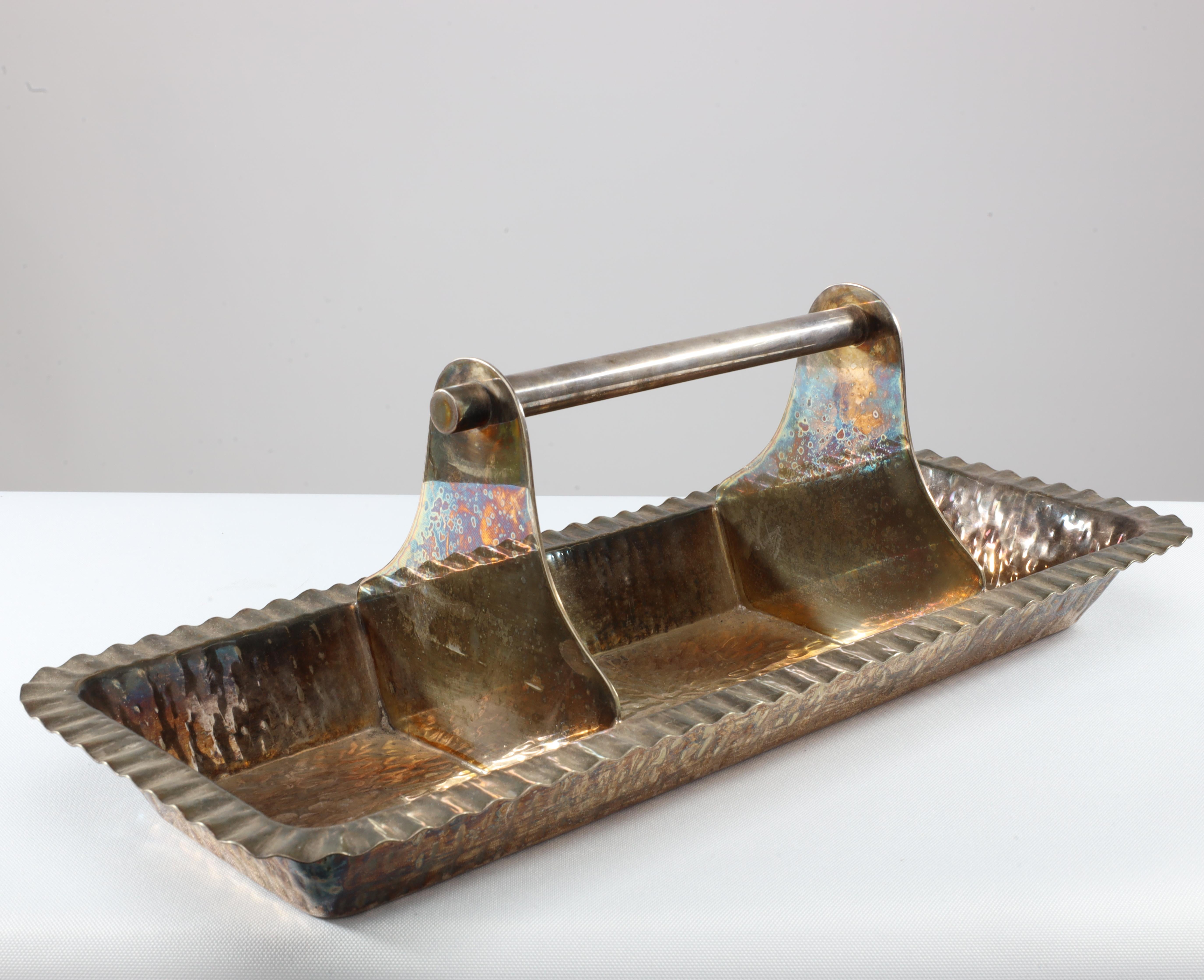 An Aesthetic Movement electro-plated oblong tray by Hukin and Heath, stamped marks, in the manner of Dr. Christopher Dresser.
 