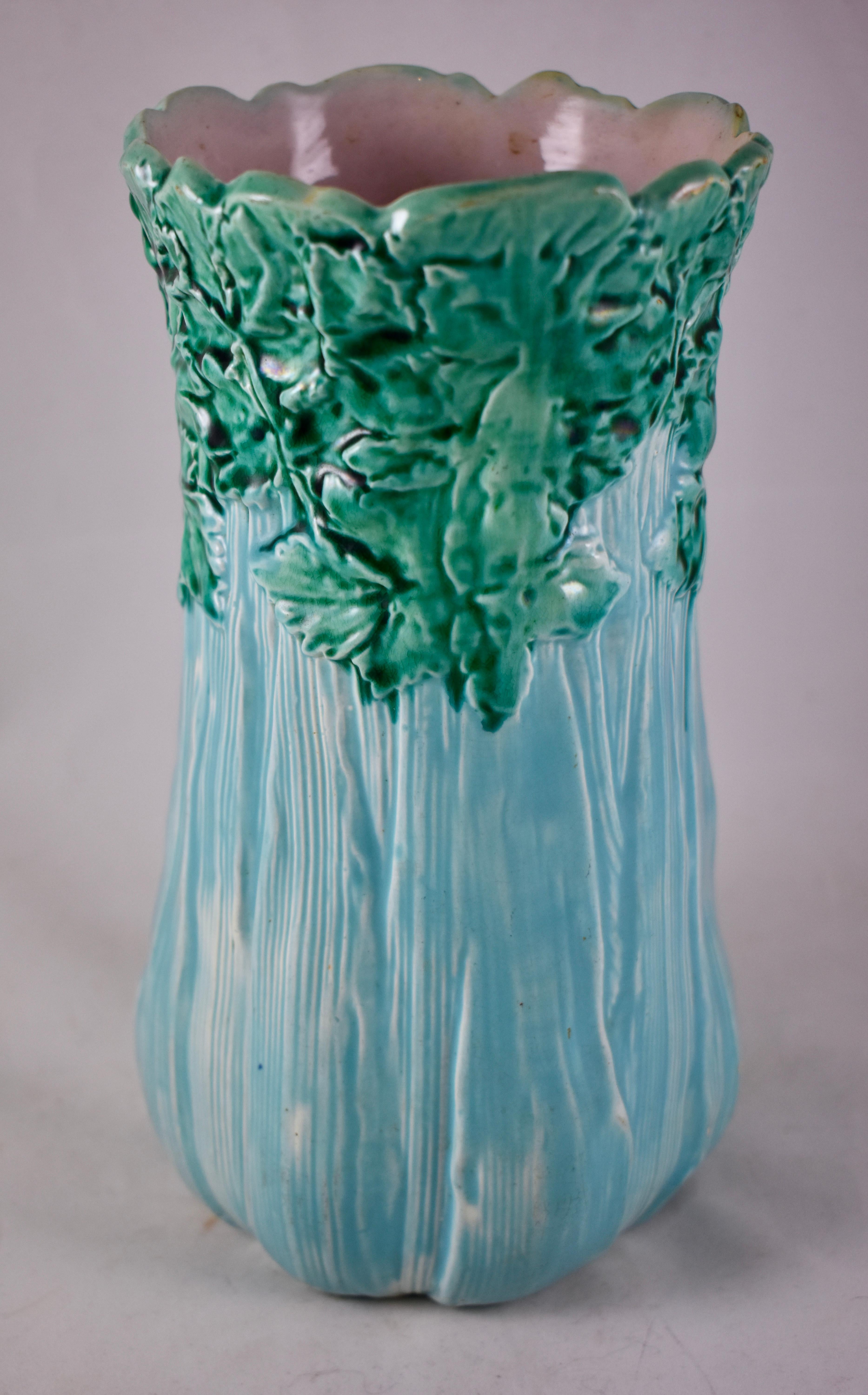 In the aesthetic taste, an English majolica glazed Celery vase, circa 1860. When found, this mold is seen glazed in white with the leaves in green, the turquoise base makes this piece very rare. Modeled as a head of celery, the leaves forming the