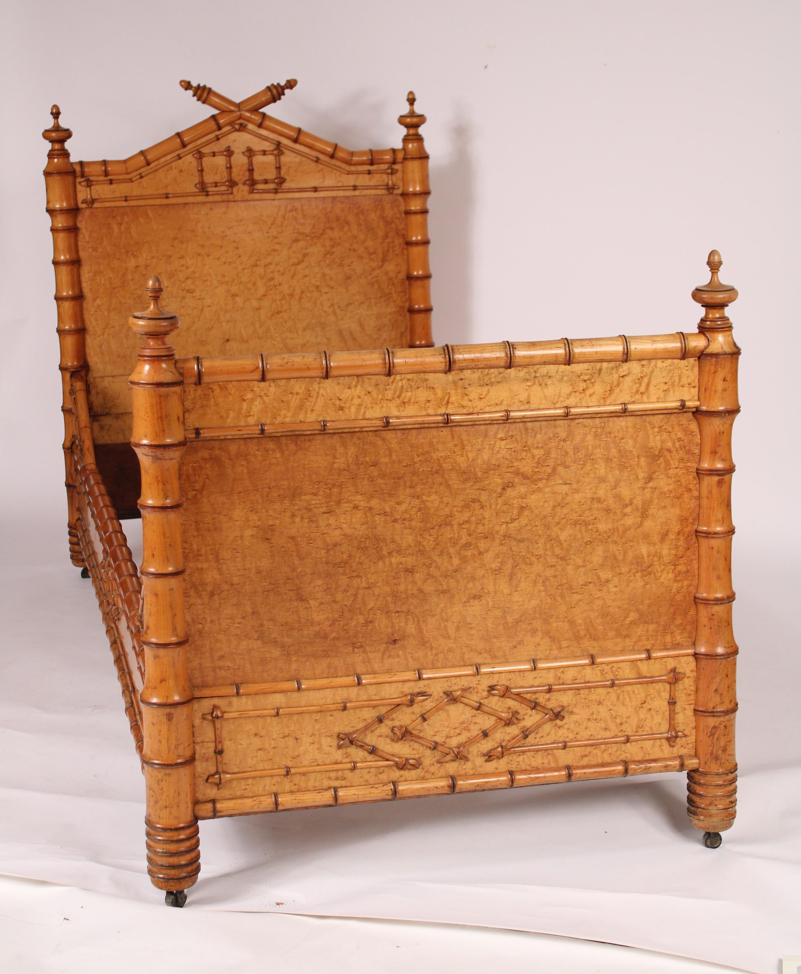 Aesthetic movement birds eye maple and birch bed, circa 1900. The inside of the headboard with faux bamboo turnings and a large birds eye maple inset panel, both inside and outside of footboard with a birds eye maple panel and faux bamboo turnings