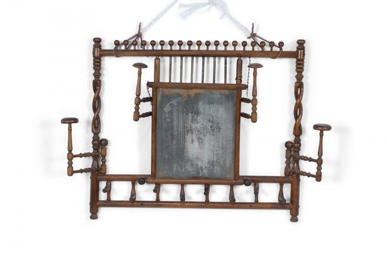 American Victorian Aesthetic Movement faux bamboo maple wall hatrack with pivoting hooks and hat stands below a central antique rectangular mirror.
  