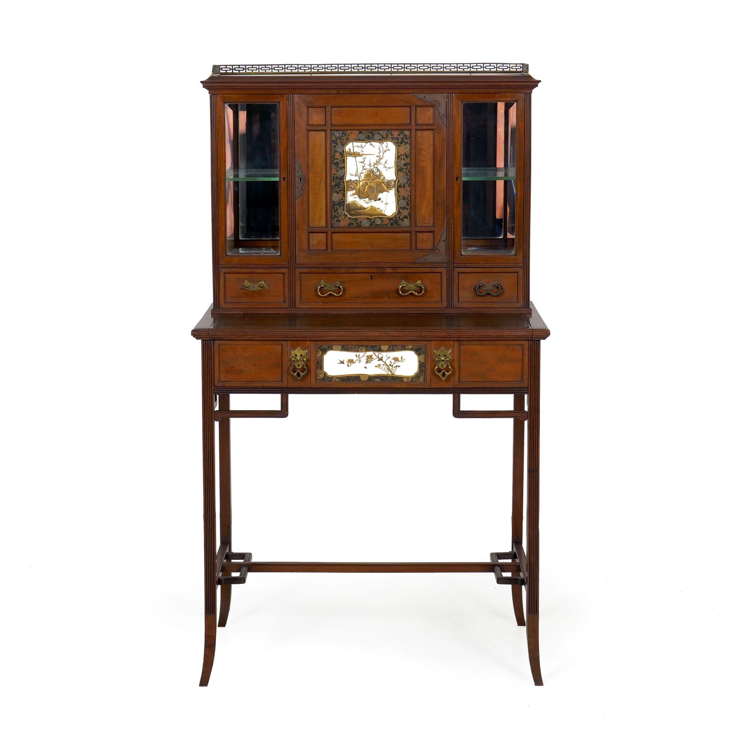 A fine blend of George III traditionalism with Japanesque ornament, this petite secretary desk cabinet is generally called a 