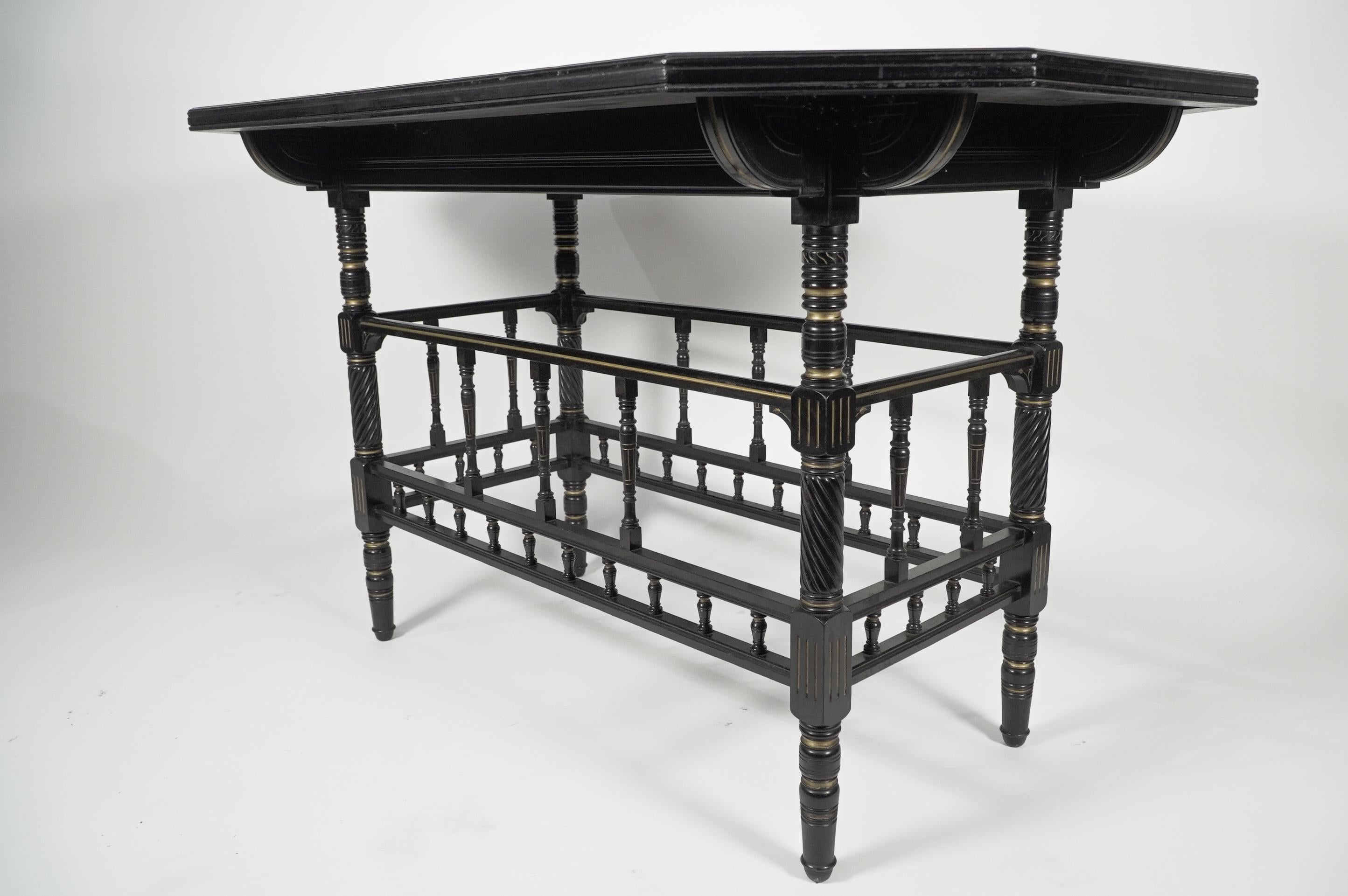 Ebonized Gillows attri An Aesthetic Movement oblong ebonized & Gilded walnut centre table For Sale