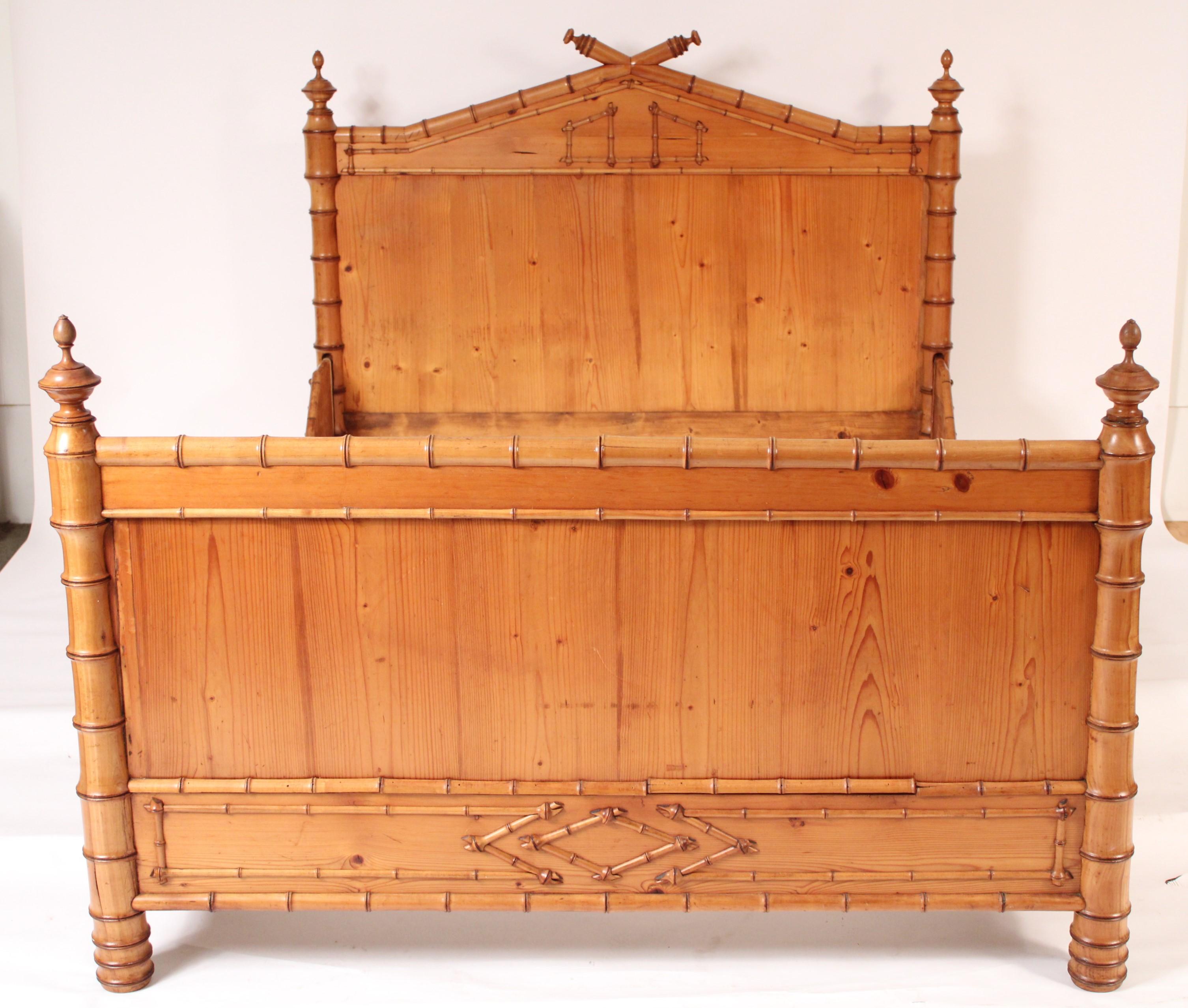 Aesthetic movement faux bamboo, pine and birch bedframe, circa 1910. With headboard, footboard and rails. The faux bamboo decoration is birch and the panels on the headboard and footboard are pine. Outer measurements, height 47.25