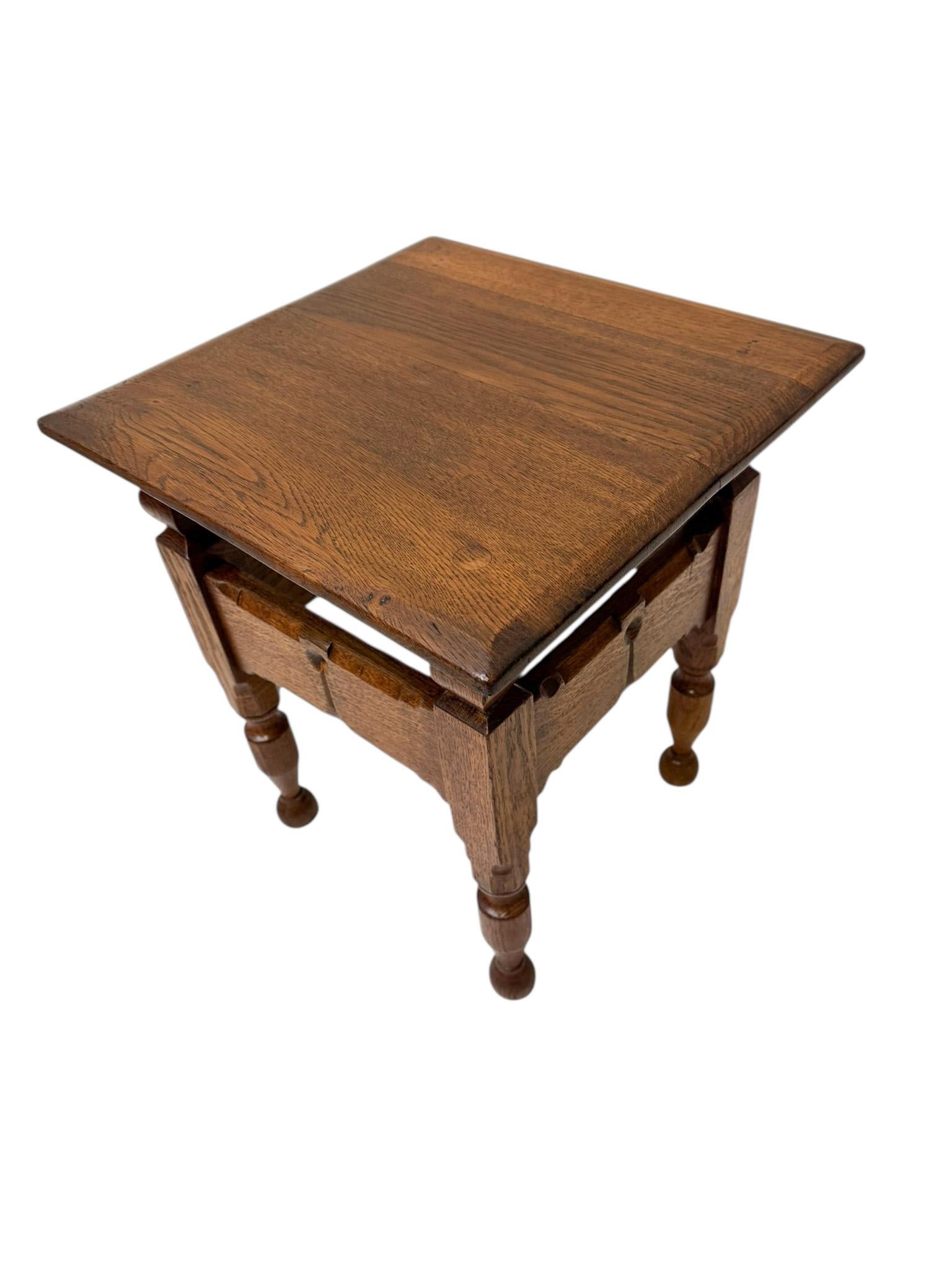Stunning and elegant Aesthetic Movement side table.
Design by C. Fischer Amsterdam.
Striking Dutch design from the 1900s.
Solid oak base with original solid oak top.
Marked with manufacturers stamp underneath the top.
This wonderful Aesthetic