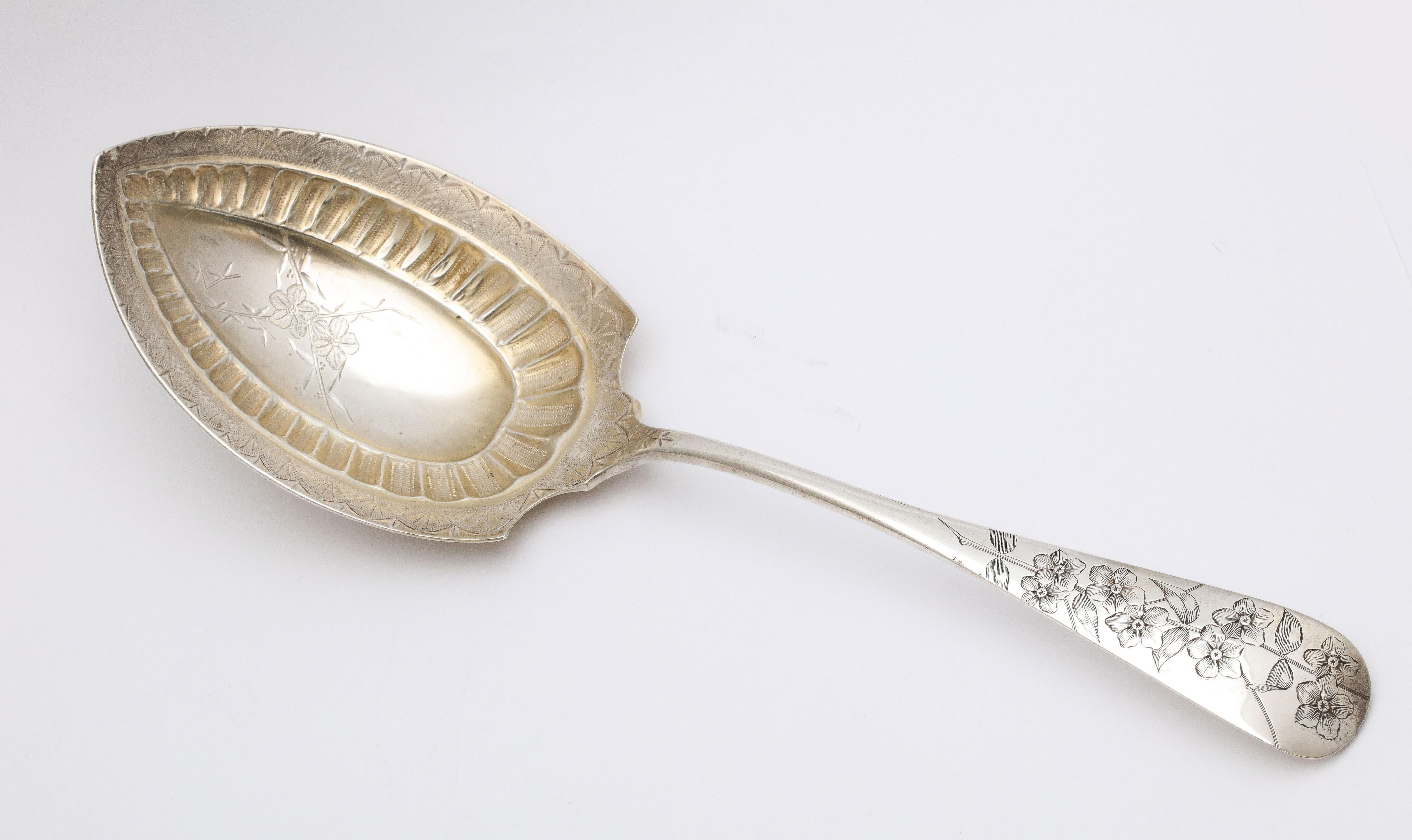 Large, beautiful, Aesthetic Movement, sterling silver, parcel gilt serving spoon (great for vegetables, cake/pie, desserts, potatoes, etc.), J.E. Caldwell, Philadelphia, Ca. 1880's. Bowl of spoon is gilded and has a lovely bright -cut design so that