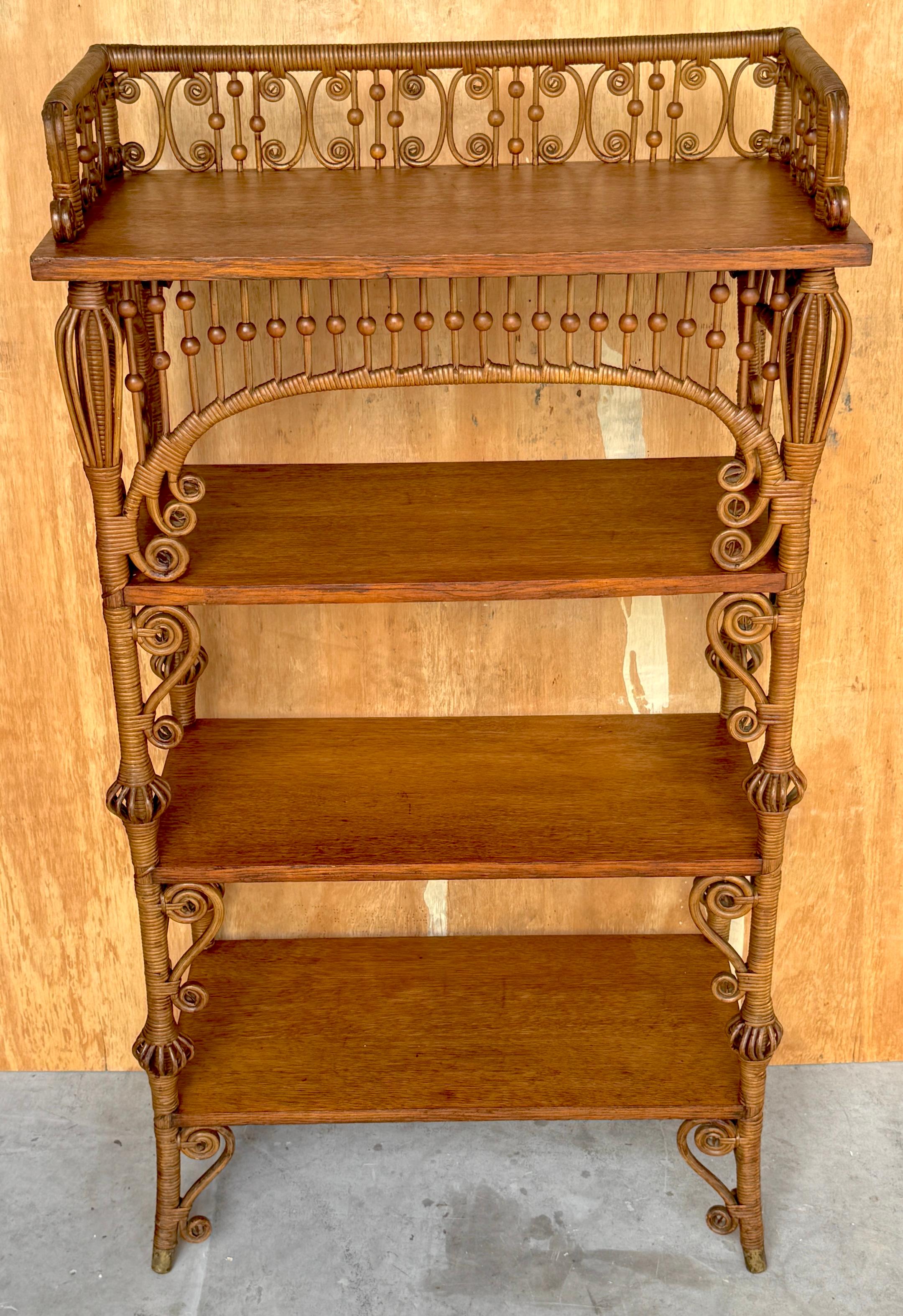 19th Century Aesthetic Movement Stick & Ball Wicker & Oak Bookcase/Shelf by Heywood Wakefield

USA, Circa 1880 Bearing Remnant of Heywood Wakefield Label 

A remarkable Aesthetic Movement survivor, this Heywood Wakefield Stick & Ball wicker and oak