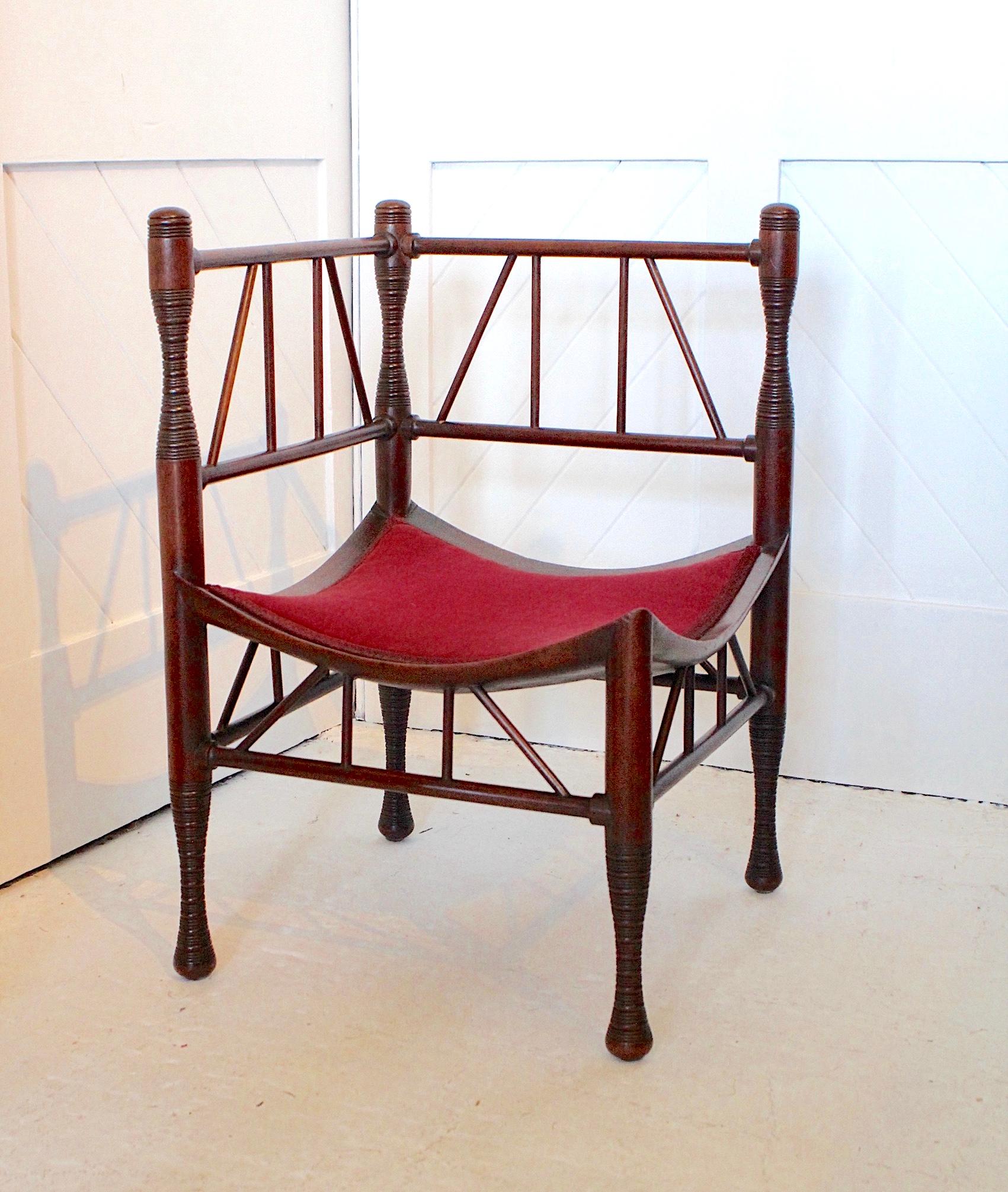 Aesthetic Movement rare ‘Thebes’ walnut corner chair
Red velvet seat
By Liberty & Co
Circa 1875.
 