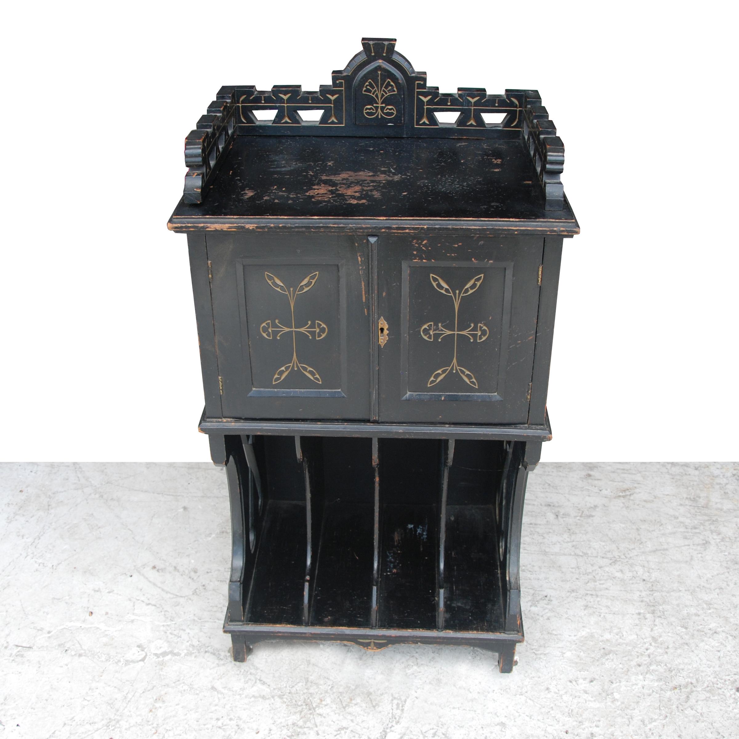 Victorian ebonized music cabinet,
Late 1890s

Victorian era ebonized music cabinet. Incised design in front and sides.
2 doors reveal additional storage.


 
