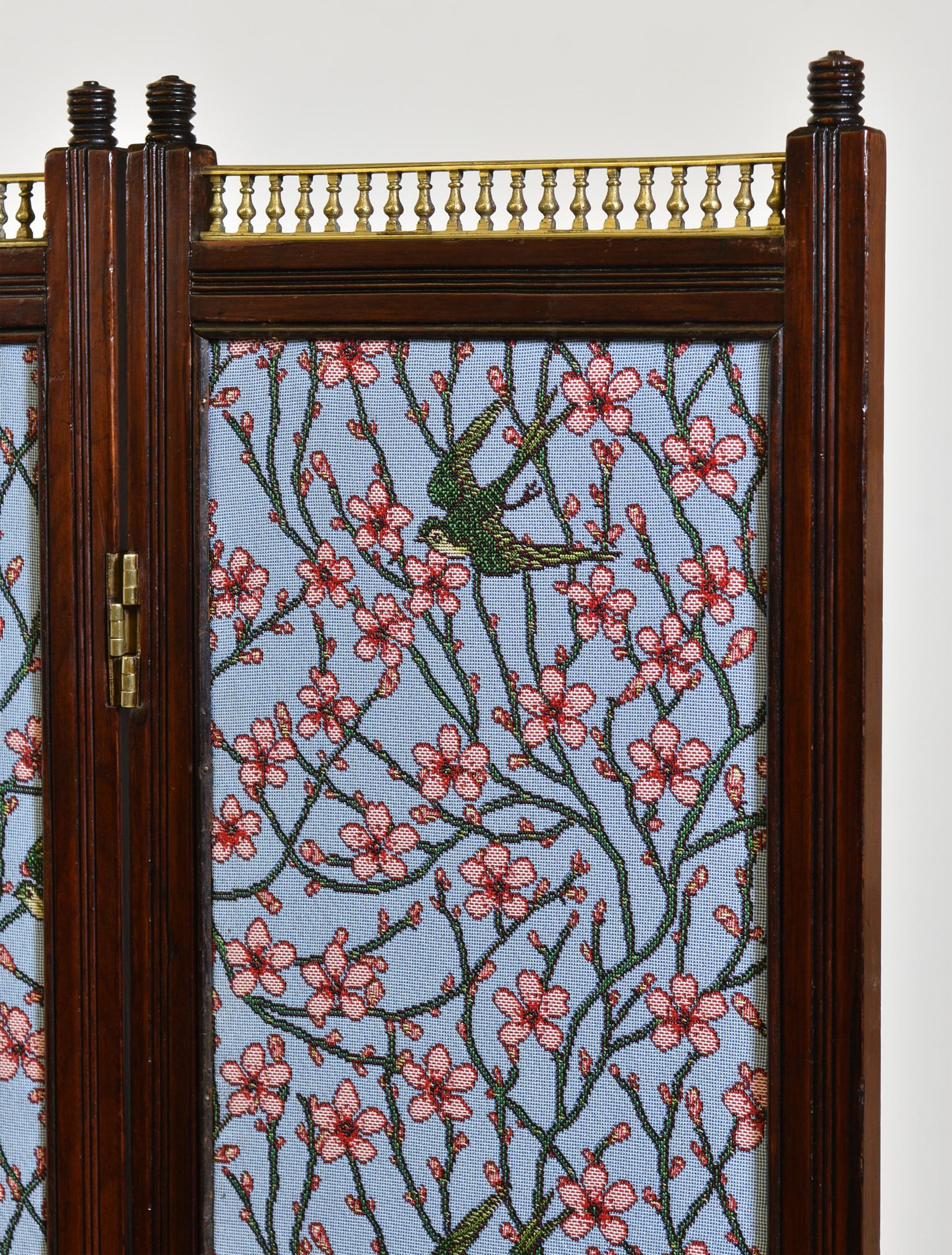 An Aesthetic Movement walnut and brass mounted folding low screen. Circa 1870.

The double sided fabric has been replaced with modern Walter Crane, Swallows and Almond Blossom Tapestry Weave to one side, and duck egg 100% silk to the other.

The