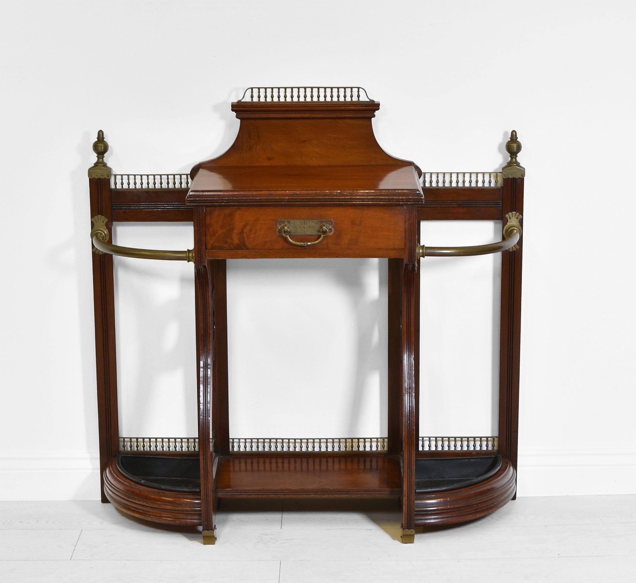 A superb Aesthetic Movement walnut and brass mount hall stand attributed to James Shoolbred - London. Kite registration stamps - Dated 1883.


James Shoolbred & Co were a firm of high quality furniture designers and manufacturers established in