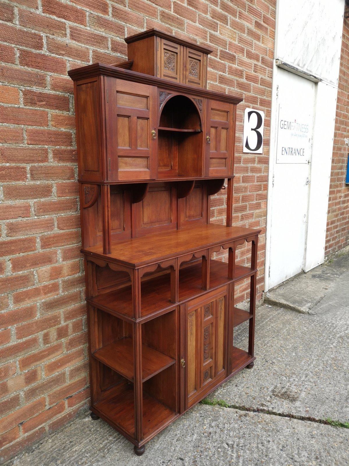 English Aesthetic Movement Walnut Cabinet of Architectural Form with Carved Decoration. For Sale
