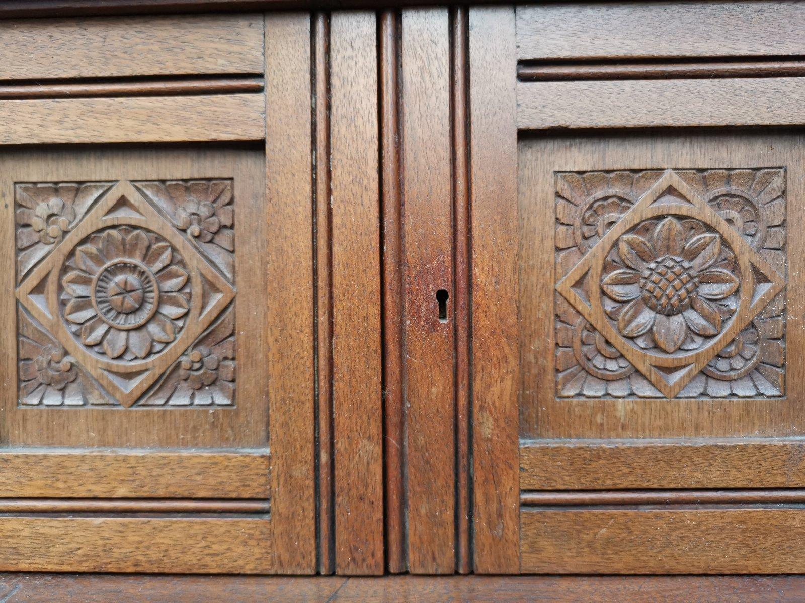 Late 19th Century Aesthetic Movement Walnut Cabinet of Architectural Form with Carved Decoration. For Sale