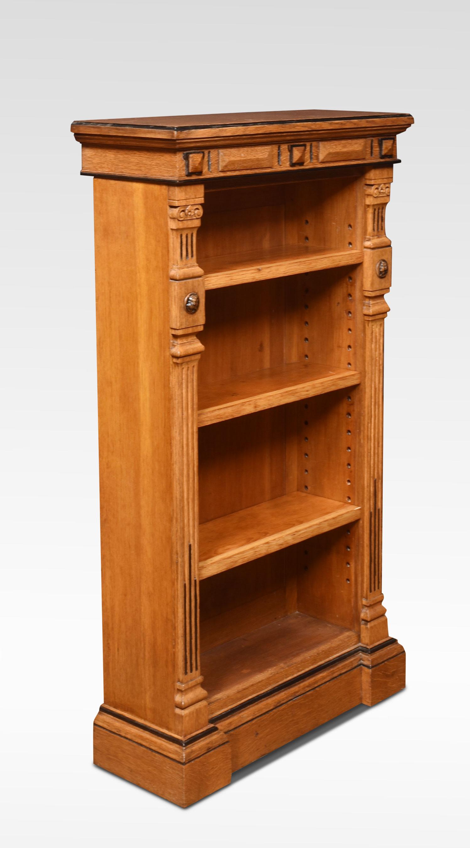 Aesthetic oak open bookcase of small proportions, the rectangular top above a carved frieze with ebonized detail, to the adjustable shelving flanked by reeded columns. All raised up on plinth base.
Dimensions
Height 44.5 Inches
Width 24