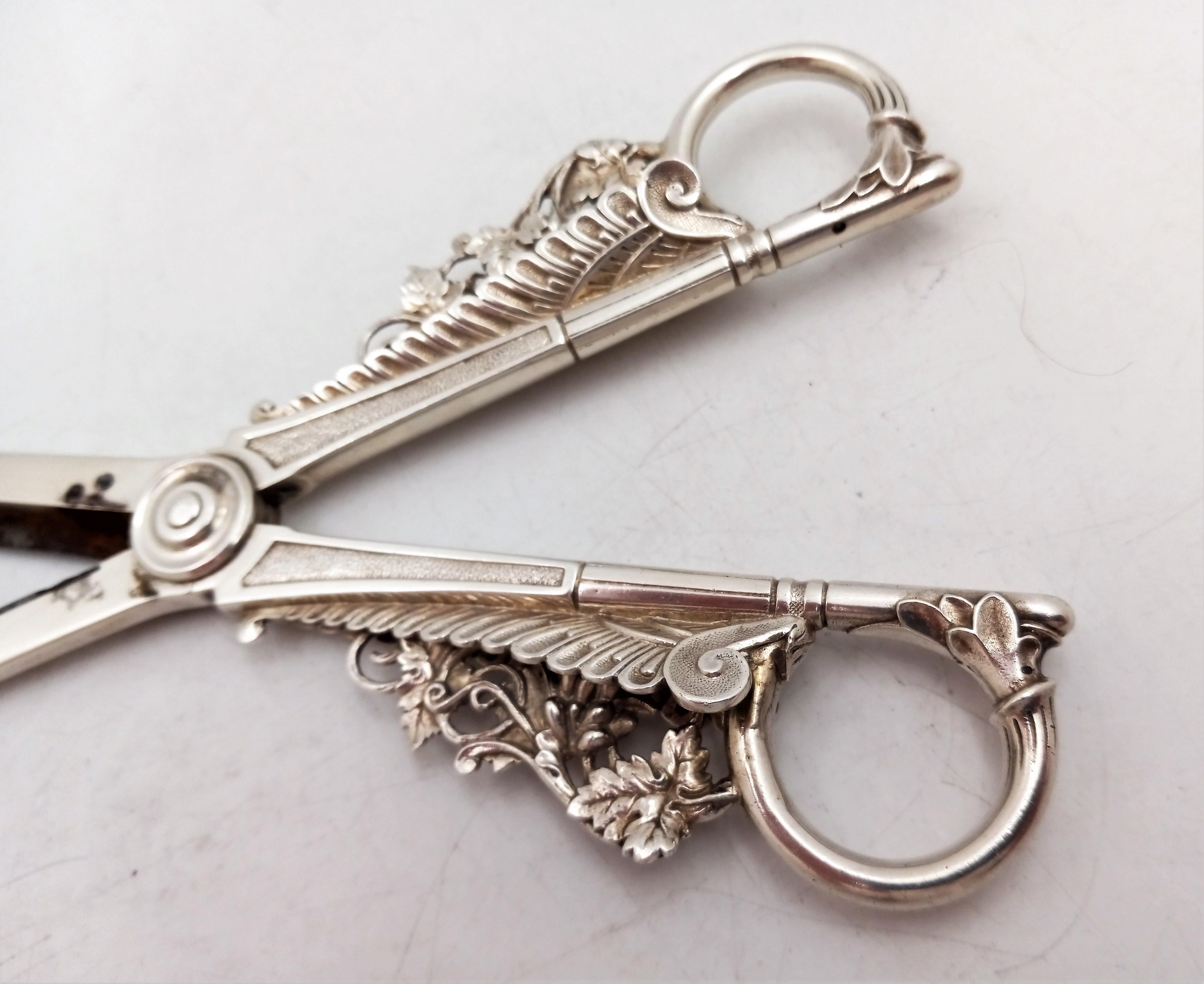Aesthetic ornate grape shears -- sterling silver by Gorham Silversmiths, circa 1870. Steel reinforcement blades are attached to the sterling blades. Measures: length: 6 1/2