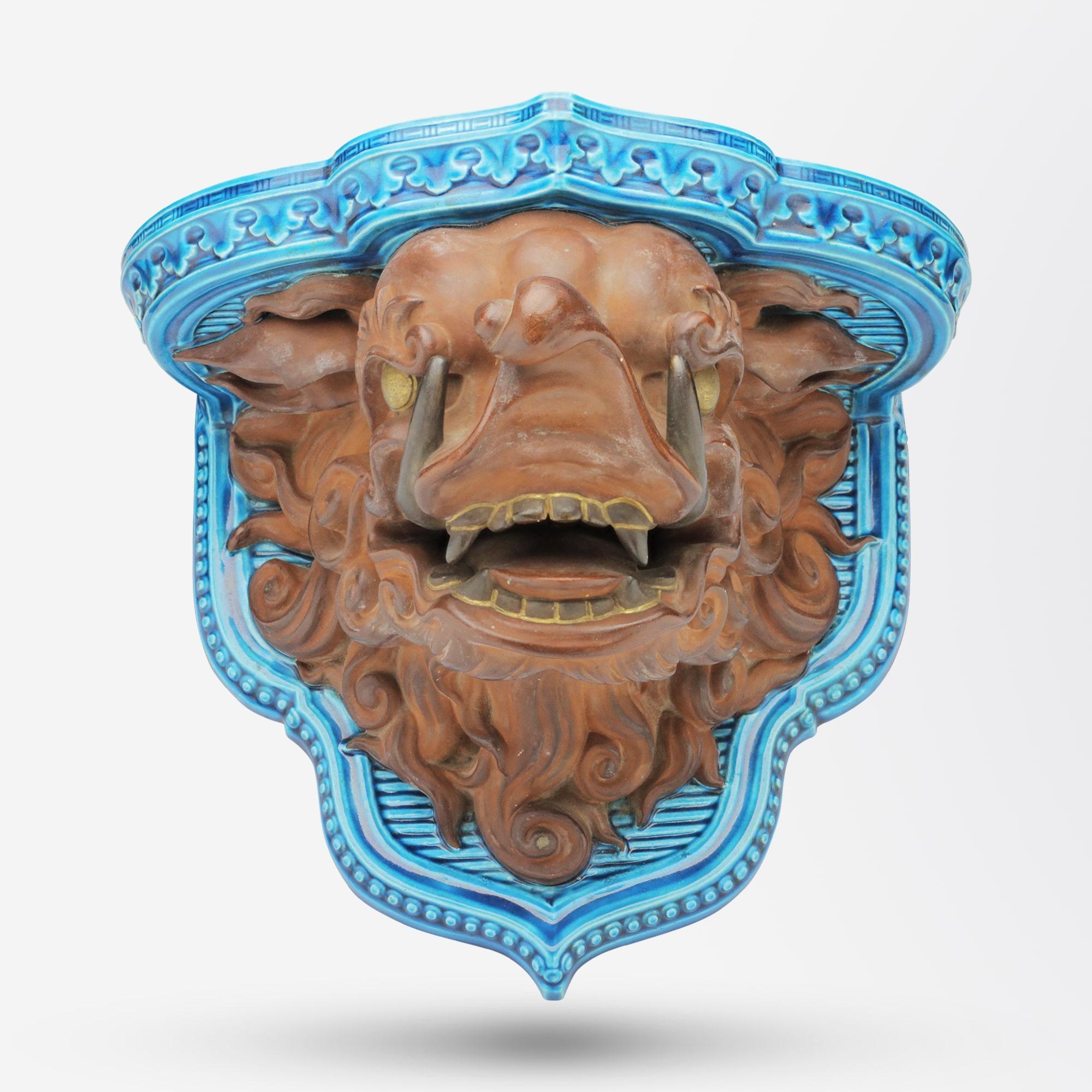 A marvellous 1870s period porcelain wall bracket by English maker Royal Worcester. The porcelain bracket has a rich turquoise ground which has been softened with a matte 'rust' glaze to the Buddhistic lion head and features small highlights of gold