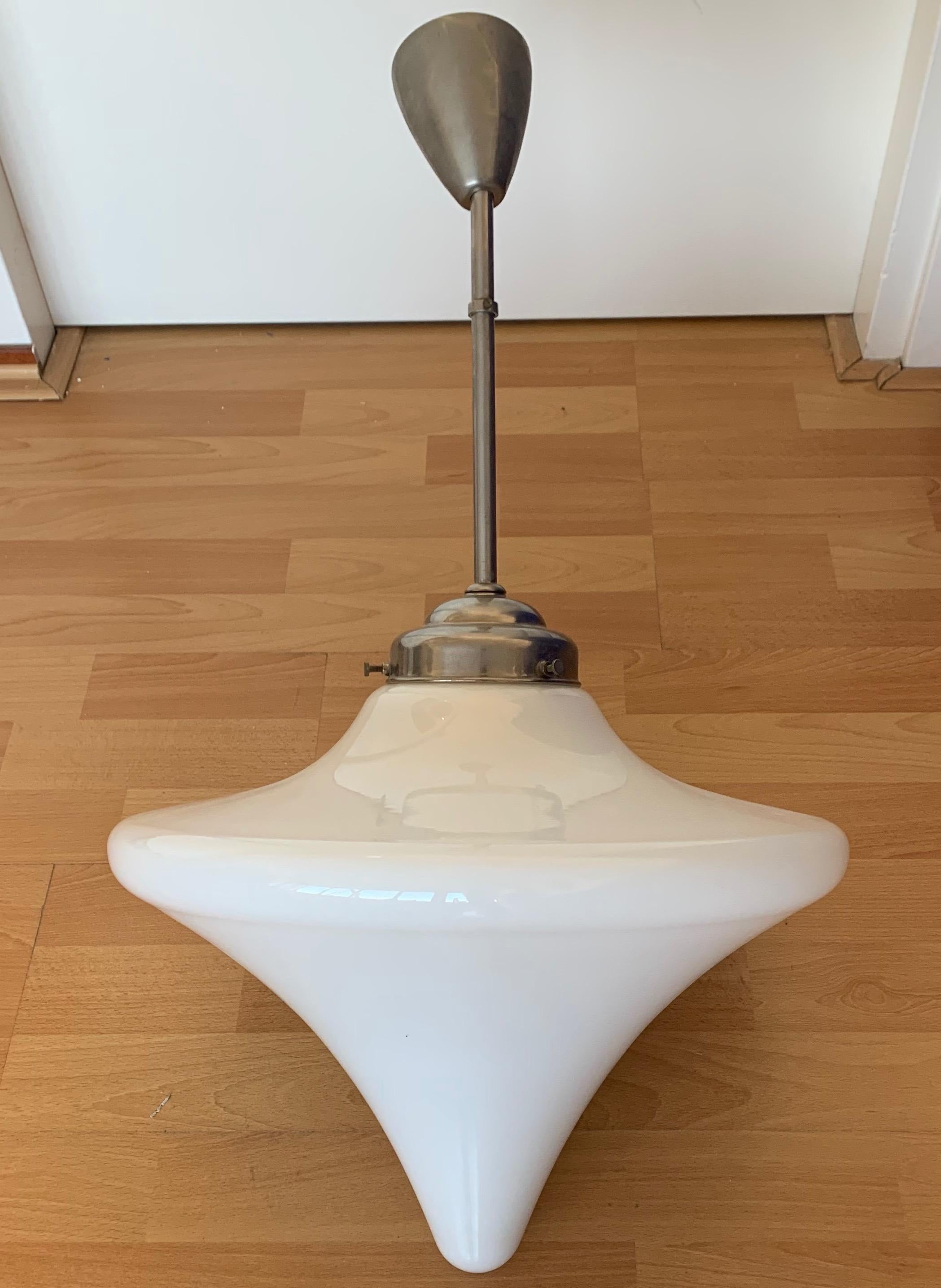 Large size 1920s Bauhaus style fixture with original rod and canopy.

This stunning and extremely rare design opaline glass pendant is in excellent condition. If we were in the business of having unique and exceptional designs from the past