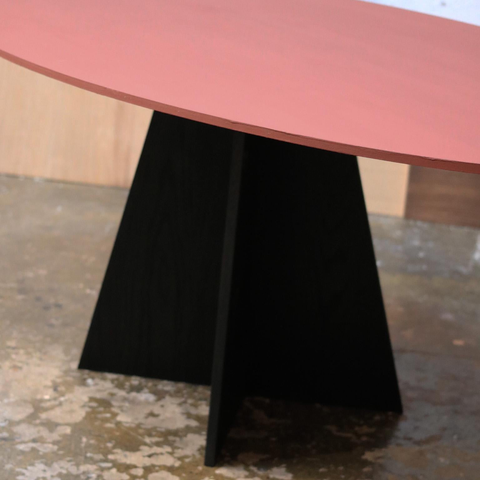 The Aether Table features a solid cherry top, painted to the customer's specifications.  The table top is shown here in 'Cardinal Red' by Pure And Original. The base is crafted from solid red oak and finished in India ink.  

This piece is entirely