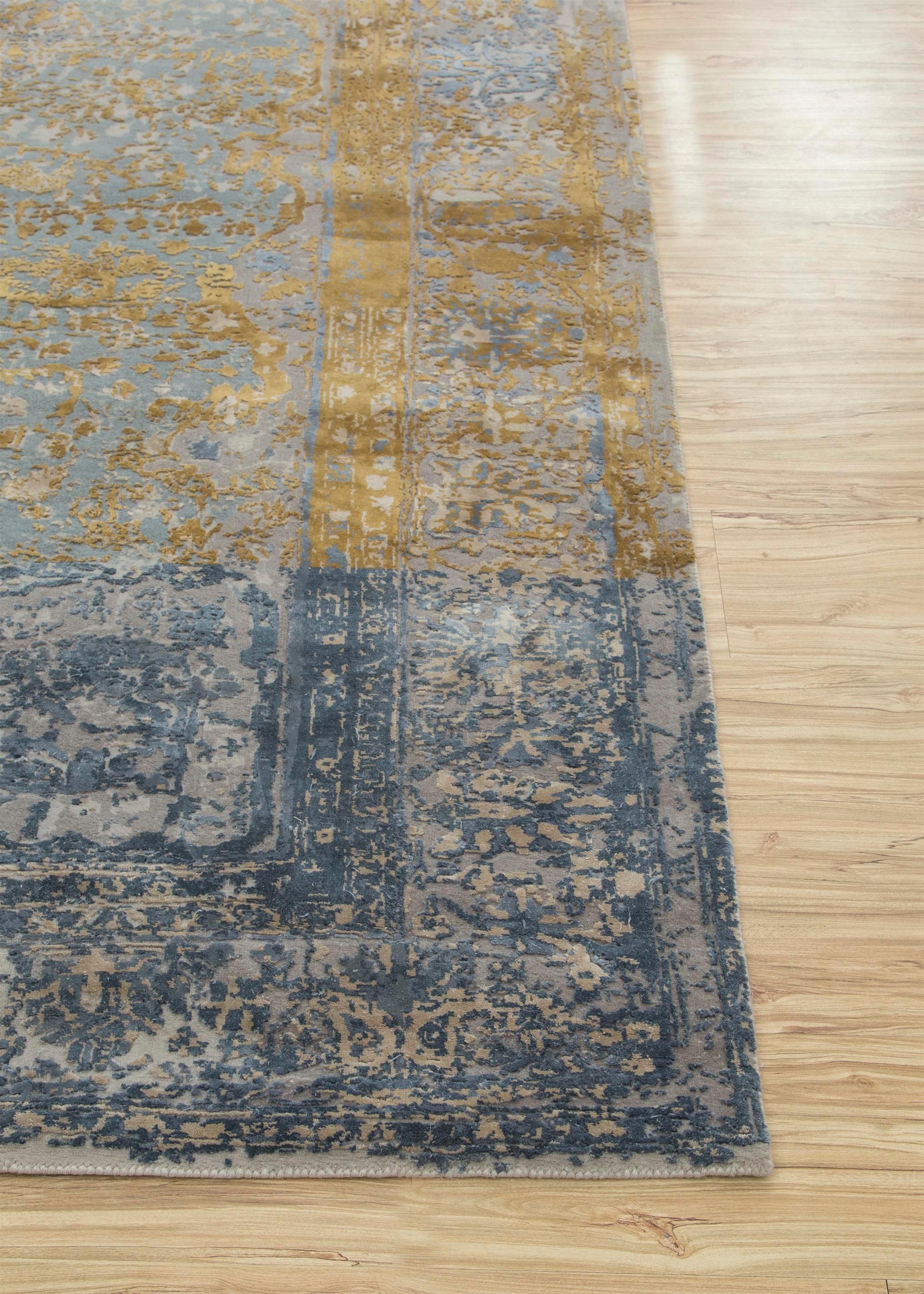 Dive into the ethereal beauty of this hand-knotted rug . The blue haze ground and crystal gray border seamlessly blend modern design with intricate tales lost in translation between hand and machine. This masterpiece showcases elements like