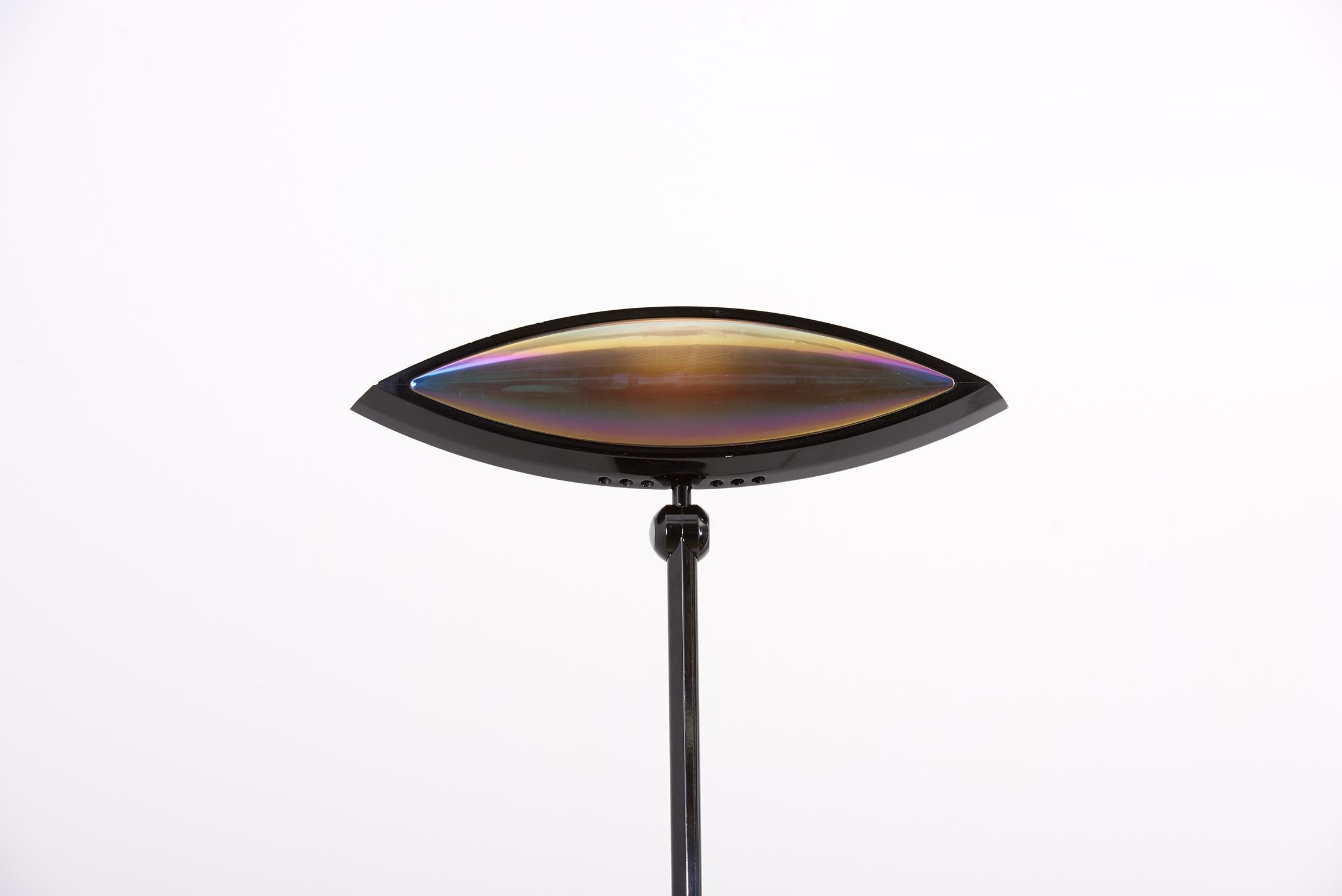 'Aeto' by Fabio Lombardo for Flos, blue floor lamp in the shape of an eye, Italy, 1980s. Well-designed floor lamp that features an adjustable eye-form light and features a round black metal base and a blue stem. This lamp is archetypical for postwar