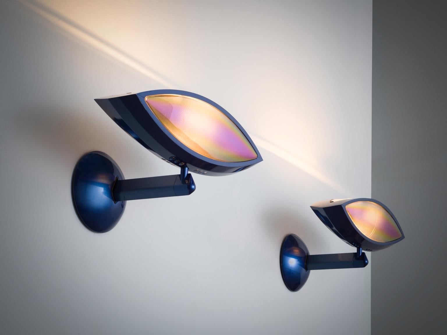 'Aeto' by Franco Lombardo for Flos, blue wall lights, metal, Italy, 1980s.

Well-designed wall lights that features an adjustable eye-form Light and features a round black metal base and a blue stem. This lamp is archetypical for post-war Italian