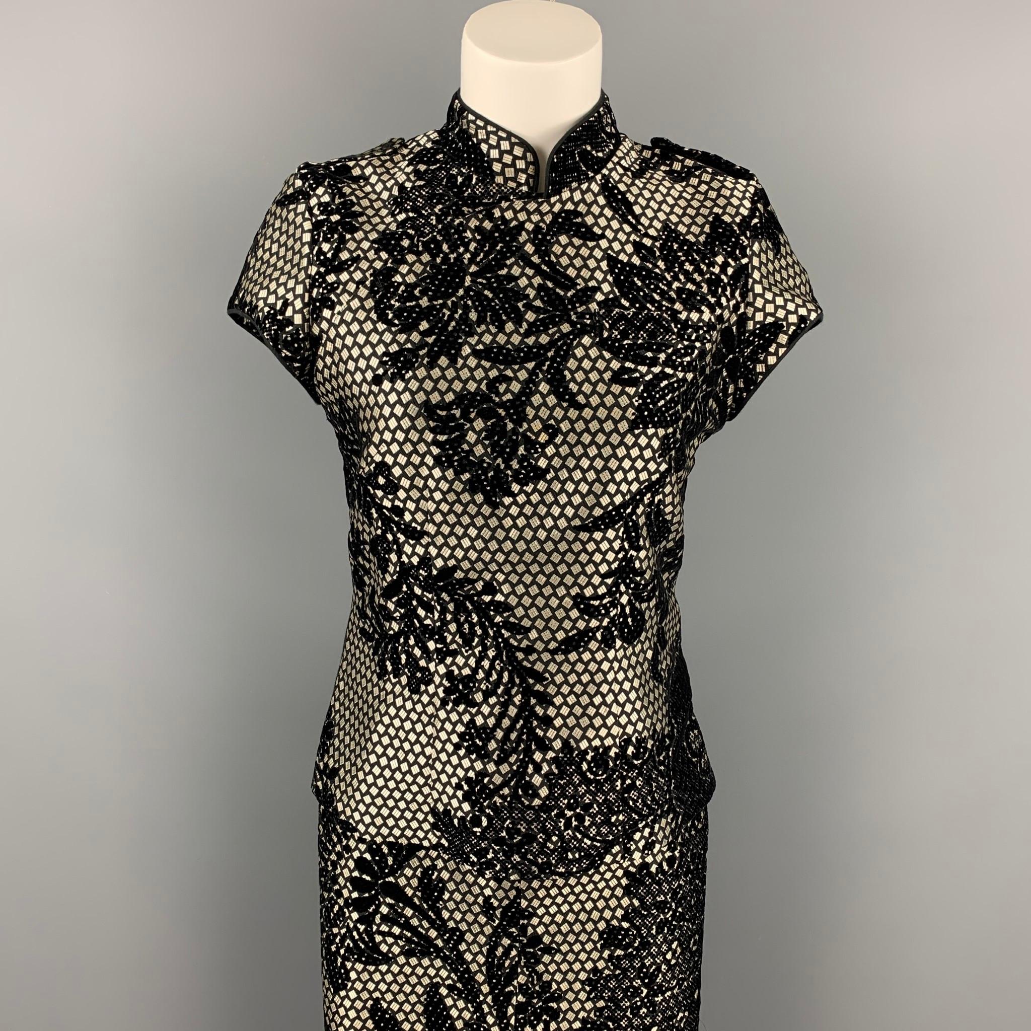 A.F. VANDERVORST skirt set comes in a black & silver jacquard acetate with velvet cut-outs featuring a nehru collar, front buttoned detail, back zip up closure and a matching pencil skirt. Made in Belgium.

Very Good Pre-Owned Condition.
Marked: